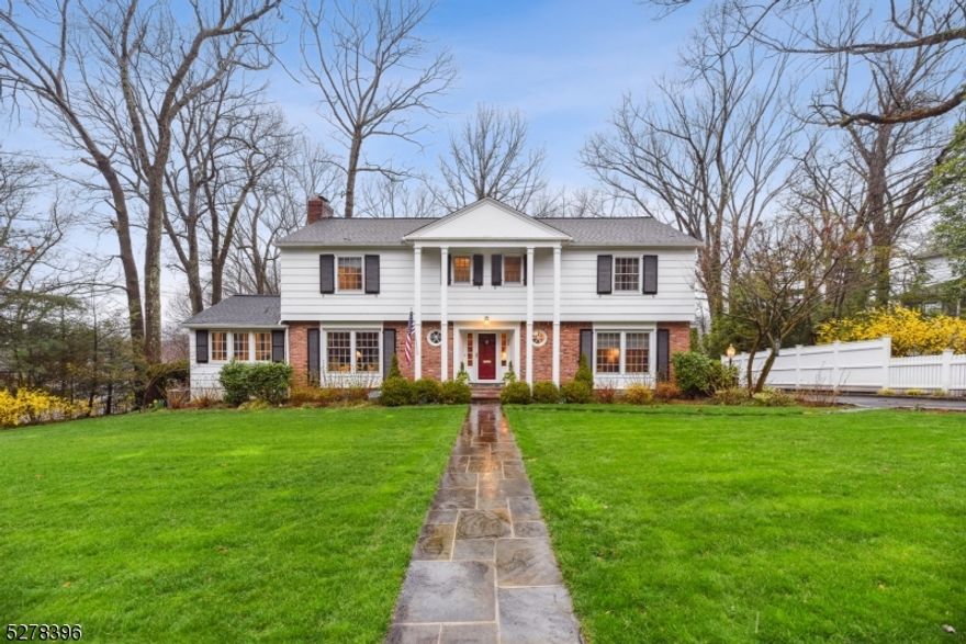 Move right in to this beautiful Woodland Park Colonial that has been meticulously maintained and updated to perfection.  So bright and spacious with gleaming hardwood floors, elegant woodwork and classic built in shelves, .  The first floor is an entertainer's dream with a large fireside Living Room, Dining Room with a picture window overlooking the perfectly landscaped backyard, updated kitchen with superior custom cabinetry, high end stainless steel appliances and Granite countertops.  The first floor also offers a Powder Room, Family Room and a Sunroom where you can enjoy the most magnificent sunsets daily.  The second floor has four large sized bedrooms with an abundance of closet space.  The Primary Bedroom offers an exquisitely updated Primary Bathroom and Walk in Closet.  Fabulous lower level with a walk out rec room to a private backyard. Basement has a bounty of space, laundry room, powder room and garage entrance.  Close to schools, train and everything great Summit has to offer.