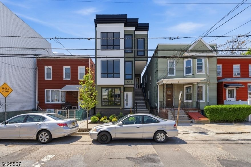 Experience elevated living in this stunning new construction 3-bedroom, 2-bath residence, thoughtfully designed with modern finishes and exceptional attention to detail throughout.Step inside to find hardwood floors spanning the entire home, complemented by sleek LED lighting that enhances the clean, contemporary aesthetic. The open-concept living and dining area flows seamlessly into a beautifully appointed kitchen featuring quartz countertops, stainless steel appliances, and a built-in undermount microwave for a streamlined look.The spacious primary suite offers a private retreat, complete with its own terrace perfect for quiet mornings or unwinding at the end of the day. Each bedroom is outfitted with custom-built closet systems, providing both style and functionality, while solid wood doors throughout add a touch of timeless craftsmanship.An in-unit washer and dryer bring everyday convenience, while the home's crown jewel awaits above a private rooftop deck boasting breathtaking Manhattan skyline views, ideal for entertaining or simply enjoying the cityscape.This exceptional residence combines luxury, comfort, and thoughtful design, offering a truly turnkey opportunity in a prime location.