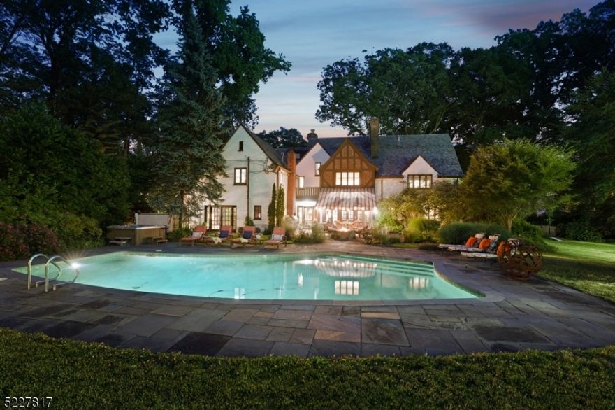 Just wait 'til you take in the grounds at this distinguished English Country Home in desirable Estate neighborhood with Tennis/Pickle ball Court, Pool, Pavilion, Putting Green & Pond! You'll find 1.74 flat acres brimming with happy aspirational lifestyle vibes & then you'll go inside & totally fall for its charms. Sophisticated yet casual & just 13 miles from NYC, the perfect home & property for entertaining & living. Large Living Room with all kinds of architectural wows, stunning formal Dining/Billiards Room, separate Office with a wall of windows. Chef's eat-in Kitchen with high end appliances, high end appliances and a center island and adjacent spacious & comfy Family Room. Easy access from Kitchen & Family Room out to the inviting Patio with gas firepit, pond & view of the private, completely enchanting property. 4 Bedrooms (plus laundry) on 2nd Floor including Primary Ensuite and the kitted out Dressing Room with Princess Balcony fit for a royal. Will you be able to pull yourself out of the 3rd floor Movie Room? There's an additional Bedroom/Office up there as well. Host tastings in the wine room on the lower level. Charming outdoor pavilion has half bath. This is a house for making memories. Close to vibrant Downtown with highly esteemed eateries, rooftop bar with NYC view, art museum, cinema, galleries, performance theatre. An exceptional opportunity to own a property of unparalleled beauty and grace.