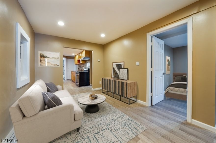 Great investment opportunity!!! with this updated 3 family in Elizabeth. Total of 9 bedrooms, 4 full baths and unfinished basement. First floor recently renovated with new kitchen, bath, floors, and appliances. First floor has 4 bedrooms, living room, kitchen and bath. Move in ready second floor with 2 bedrooms, living room, eat in kitchen and full bath. Third unit consist of two floors, with living room, eat in kitchen and 3 good size bedrooms. Separated utilities, LOW taxes! Spacious fenced in yard. Newer boilers and water heaters. This is gold mine! And a must See! Close to major highways and public transportation.