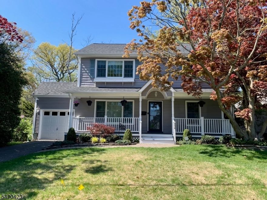 Exceptional style, privacy, and setting define this beautifully updated Colonial in Cranford's sought-after Indian Village. Backing to serene woods and **not located in a flood zone**, this home offers a rare combination of natural beauty and peace of mind. The first floor features a seamless, open layout with a spacious living room flowing into the dining area ideal for both everyday living and entertaining. The kitchen is thoughtfully designed with a center island and ample workspace, opening to a sunlit family room with tranquil views of the wooded backdrop. Sliders lead to a deck and private backyard, creating an effortless indoor-outdoor connection. Upstairs, the primary suite offers a private sitting room perfect as a home office or quiet retreat along with a full bath and generous closet space. Two additional bedrooms and a full bath complete the second level. The finished basement expands the home's versatility with a large recreation room plus a dedicated exercise or flex space, ideal for today's lifestyle needs. A sophisticated aesthetic and thoughtful design details elevate every space, blending comfort with understated elegance. Additional highlights include central air, multi-zone systems, electric fireplcae, and an attached garage (with interior access). Ideally located near Mohawk Park, top-rated schools, and major roadways, this is a rare opportunity to enjoy refined living in one of Cranford's most sought after neighborhoods.