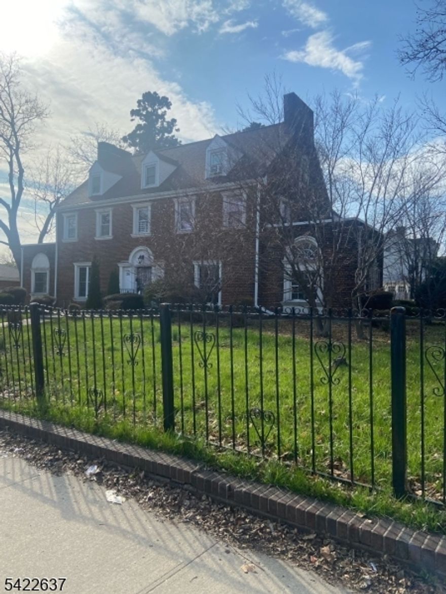 This Beautiful Stately Solid Brick Mansion Home is located at corner of Elizabeth Avenue and Vasar. The home is across the beautiful Quequack Recreational Park, near NY City Trans, Beth-Israel Hospital, Schools and Shoppings. Features Large Living Room, large Family Room or Home office, Large Kitchen with plenty of cabinets, Entrance  foyer, 6-7 bedrooms, 4 bathrooms with ceramic tiles, basement and cars garage. It's beautifully fenced, Detached cars garage and exclusive parking lot drive way. This won't Last!!!