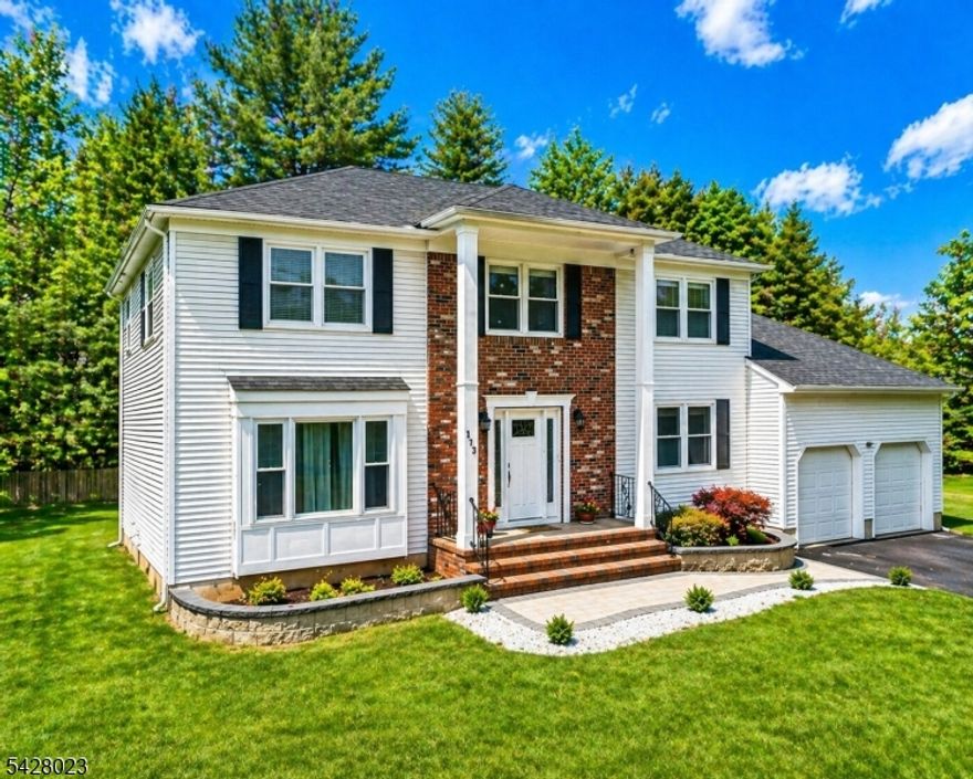 Welcome to this spacious five-bedroom Colonial, ideally situated in the highly sought-after Woodland Estates section of Hillsborough, New Jersey. Set on a beautiful property with a large, flat backyard, the home offers timeless design and exceptional space to create your own vision. A welcoming foyer introduces sun-filled living spaces, including a bright living room and a separate formal dining room, perfect for entertaining. The expansive eat-in kitchen is thoughtfully designed with abundant counter space, a new backsplash, and room for future customization. Sliding doors lead to a deck overlooking the backyard, creating effortless indoor-outdoor living. A separate family room just off the kitchen adds to the home's comfortable and functional layout. A first-floor bedroom provides flexibility for guests or a private office. A convenient half bath on the main level offers potential to be converted into a full bath, adding even greater versatility. The generously sized laundry room can easily double as a mudroom, with direct access to the backyard and the attached two-car garage .Upstairs, the spacious primary suite offers a peaceful retreat with a private bath and a large closet. The other bedrooms are all spacious and well-proportioned, offering comfort and versatility. A large basement with high ceilings presents an excellent opportunity to finish and expand your living space. Freshly painted interiors and a new roof to further enhance the home's appeal. Windows as is.