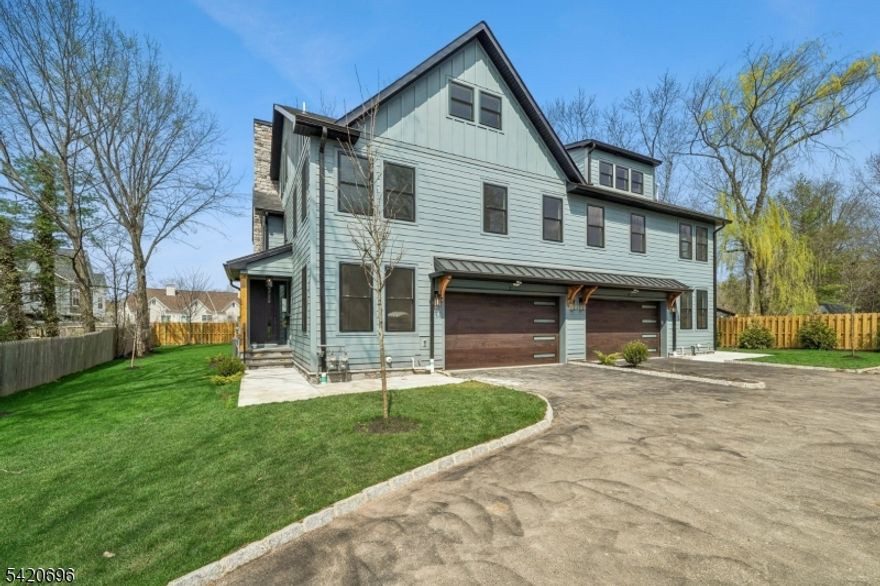 Welcome to Central Villas, a refined end-unit townhome in the heart of New Providence, & a seamless blend of modern design & effortless living. Built by Summit General Construction, this 4-level residence spans approx. 4,450 sq ft, offering 4 bedrooms, 5 full baths, & a versatile 1st-floor office or optional 5th bedroom.Designed for modern living and effortless entertaining, the home features hardwood flooring throughout. The main level showcases a striking living area anchored by a sleek gas fireplace, while the formal dining area opens to a private backyard patio, creating seamless indoor-outdoor flow.The chef's kitchen offers custom cabinetry, a waterfall island, premium Thermador appliances, & a pantry just off the garage entry,a coat closet.The 2nd floor features 3 bedrooms each with a Walk In Closet., & the primary suite offers a tray ceiling & spa-like bath with soaking tub, frameless glass shower, & designer vanities. A full hall bath & laundry complete the level.The top floor offers a sunlit, private suite with soaring ceilings, an en-suite bath, & generous storage, perfect for guests, work, or quiet retreat.The finished lower level adds even more living space, with porcelain tile flooring, decorative wall paneling, a modern electric fireplace, & a full bath ideal for a media lounge, recreation area, or home gym. Additional highlights include a 2-car garage with 12-ft ceilings, EV charger, energy-efficient systems, smart keyless entry, & a 10-year builder warranty.