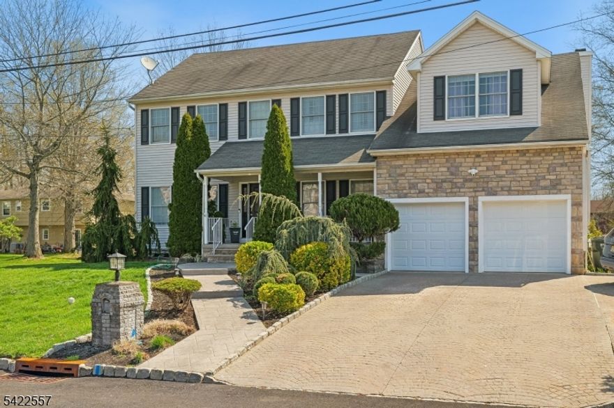 Spacious and move-in ready, this well-maintained colonial features hardwood floors throughout and a versatile layout with a living room, dining room, private home office, and a dramatic family room with soaring two-story ceilings and a fireplace. The kitchen is well-equipped with a breakfast nook, pantry, and a convenient first-floor laundry room just steps away. The second floor offers four generously sized bedrooms, including a master suite with a walk-in closet, an additional separate closet, and a private en suite bathroom, along with a second full bathroom serving the remaining three bedrooms. The finished basement is an entertainer's dream, complete with a wet bar, kegerator with tap, ping pong table, and a rough-in for a future bathroom. Outside, a paver patio and above-ground pool with an attached deck create the perfect backyard retreat, all rounded out by an attached two-car garage.