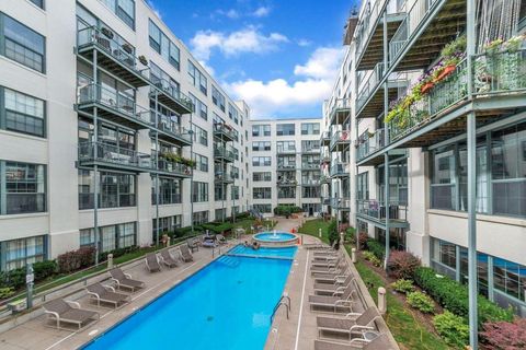 Photo of 940 Monroe Avenue NW #415, Grand Rapids, MI 49503 (MLS # 26001989)