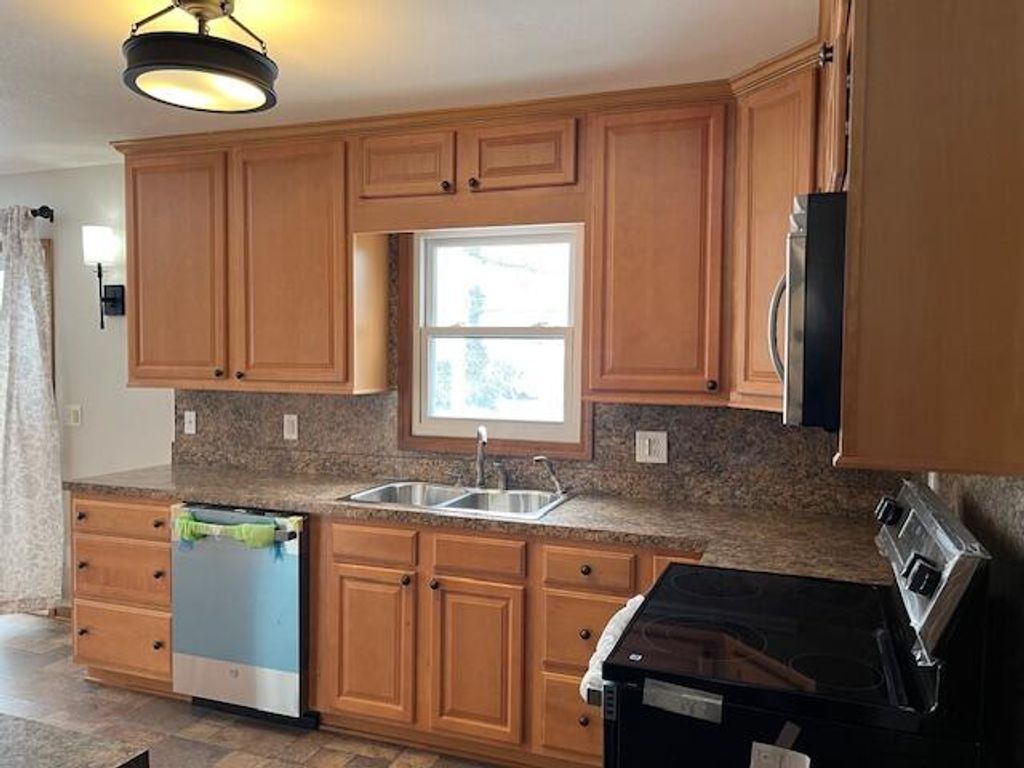 Photo of 1548 Woodside Road, Muskegon, MI 49441 (MLS # 26003805)