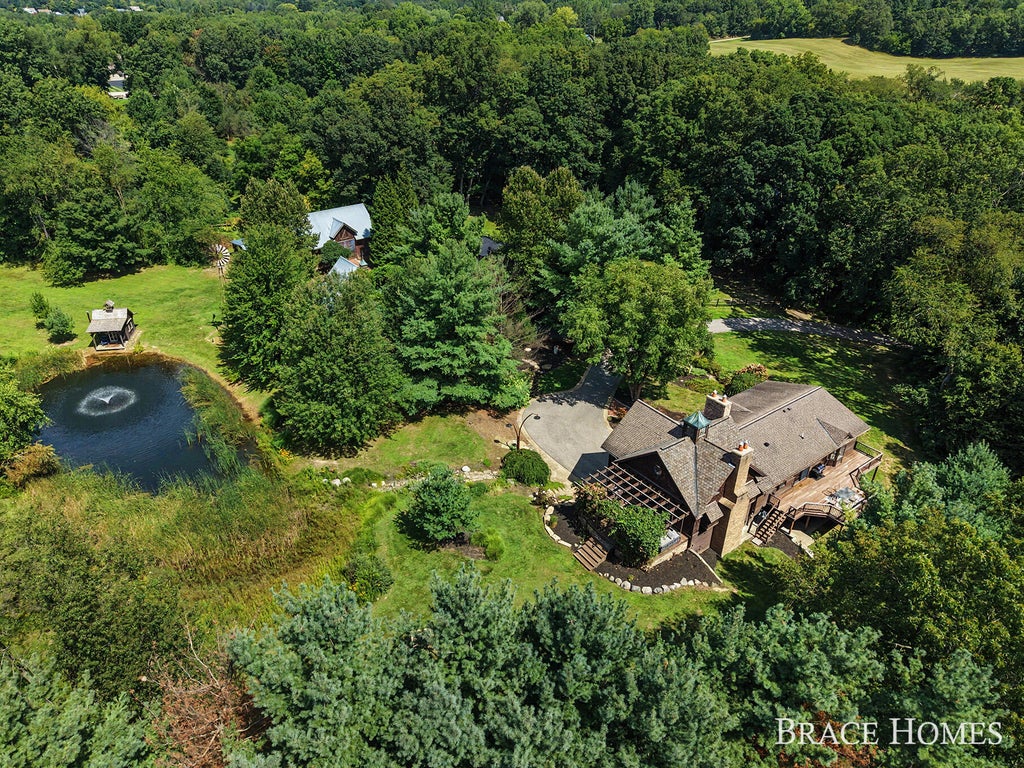 Photo of 5501 Canyon River Drive NE, Ada, MI 49301 (MLS # 26045169)