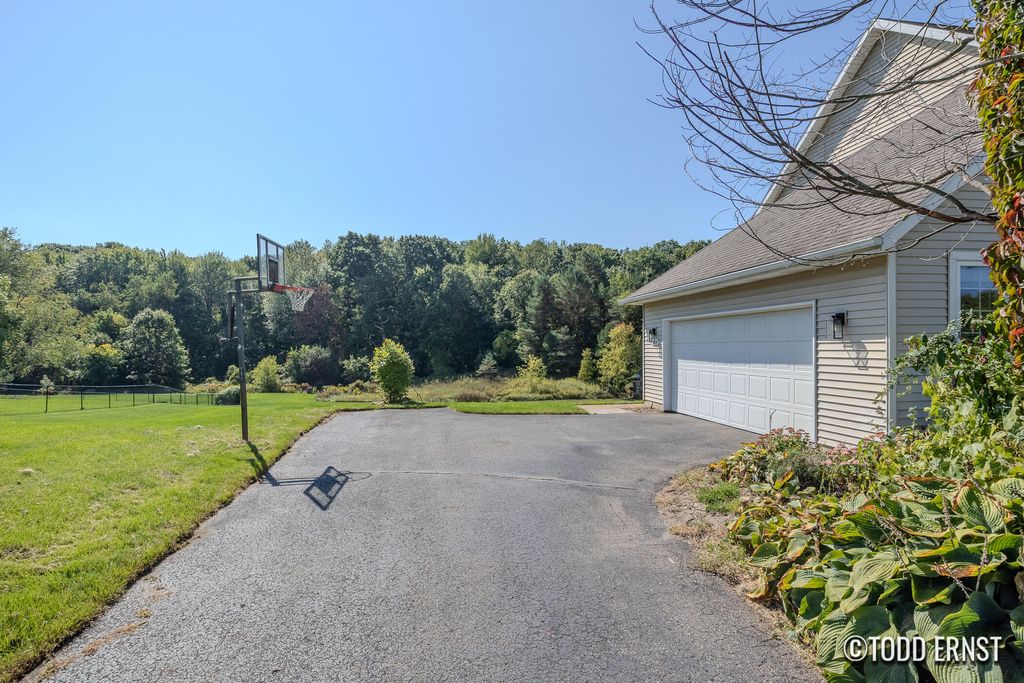 Photo of 5814 Cannon Hills Drive NE, Ada, MI 49301 (MLS # 25046882)