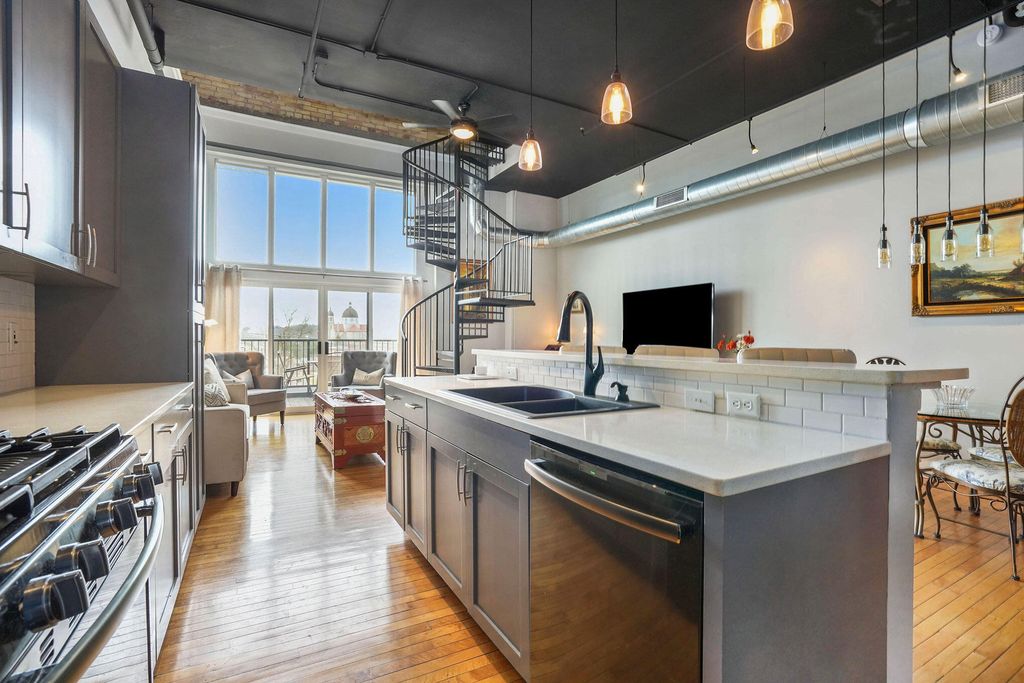 Photo of 600 Broadway Avenue NW #426, Grand Rapids, MI 49504 (MLS # 23009200)