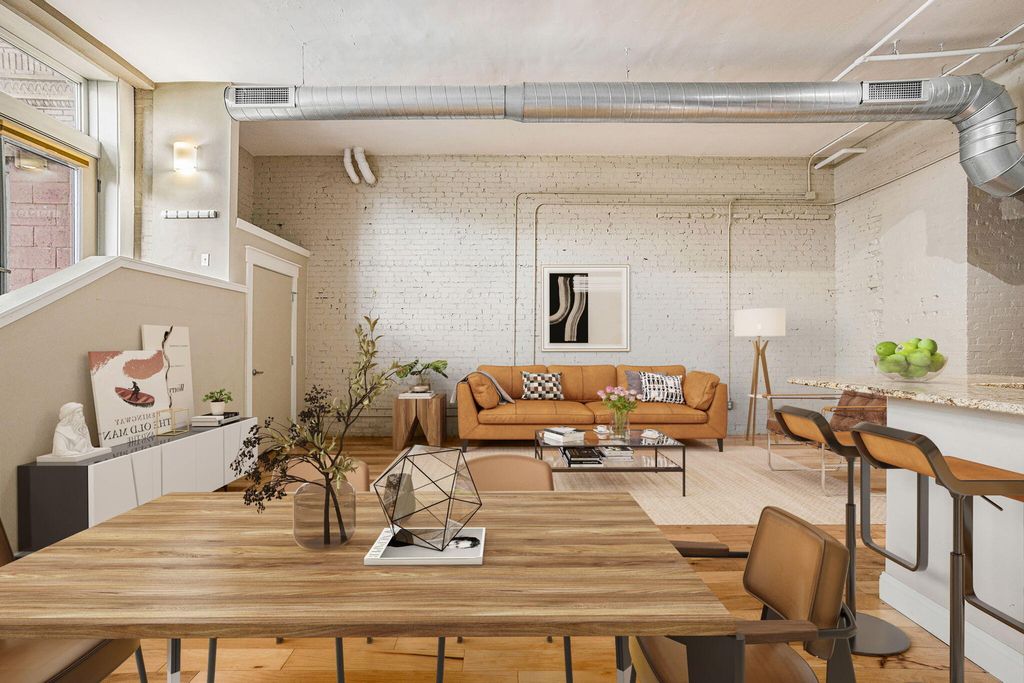 Photo of 600 Broadway Avenue NW #107, Grand Rapids, MI 49504 (MLS # 24025934)