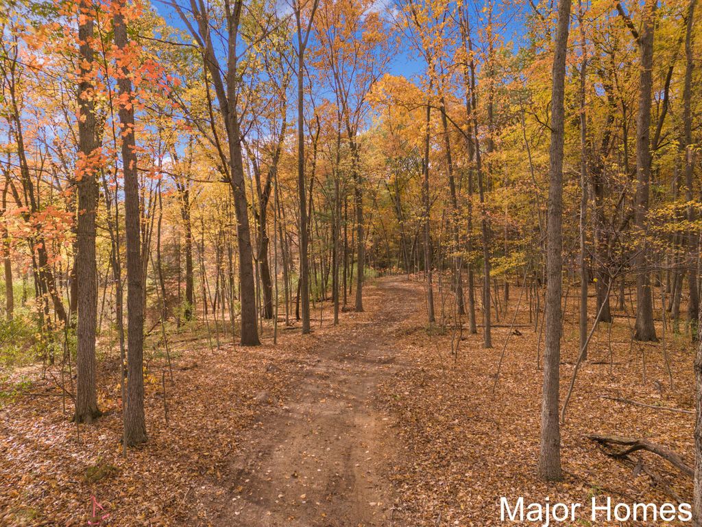 Photo of 5575 Ramsdell Drive NE, Rockford, MI 49341 (MLS # 25056193)