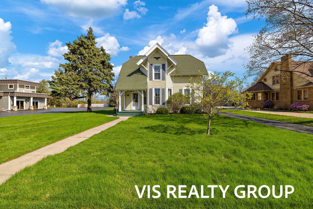 Photo of 223 E Savidge Street, Spring Lake, MI 49456 (MLS # 26000775)