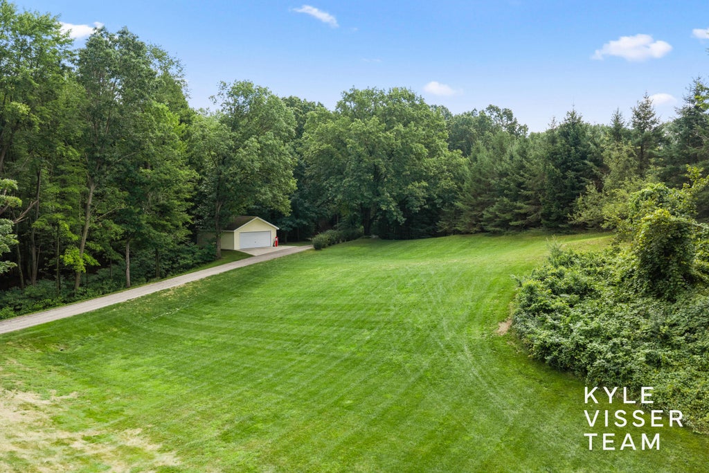 Photo of 1873 Grand River Drive NE, Ada, MI 49301 (MLS # 26043990)