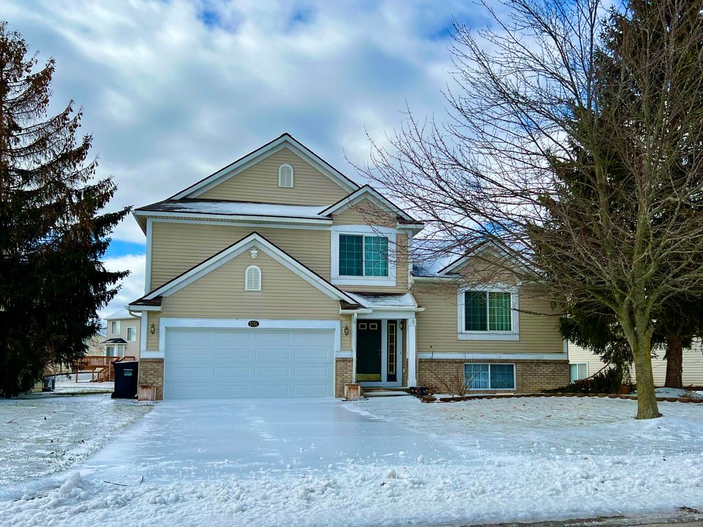 Photo of 5701 E Grove Drive SE, Kentwood, MI 49512 (MLS # 23006137)