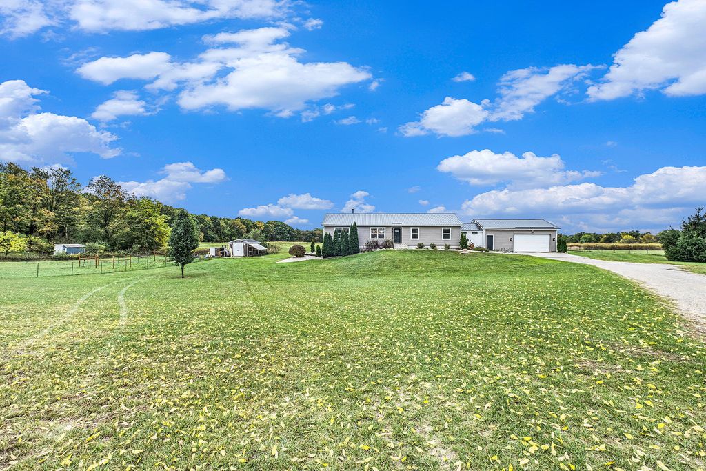 Photo of 9700 7 Mile Road NE, Rockford, MI 49341 (MLS # 25051801)