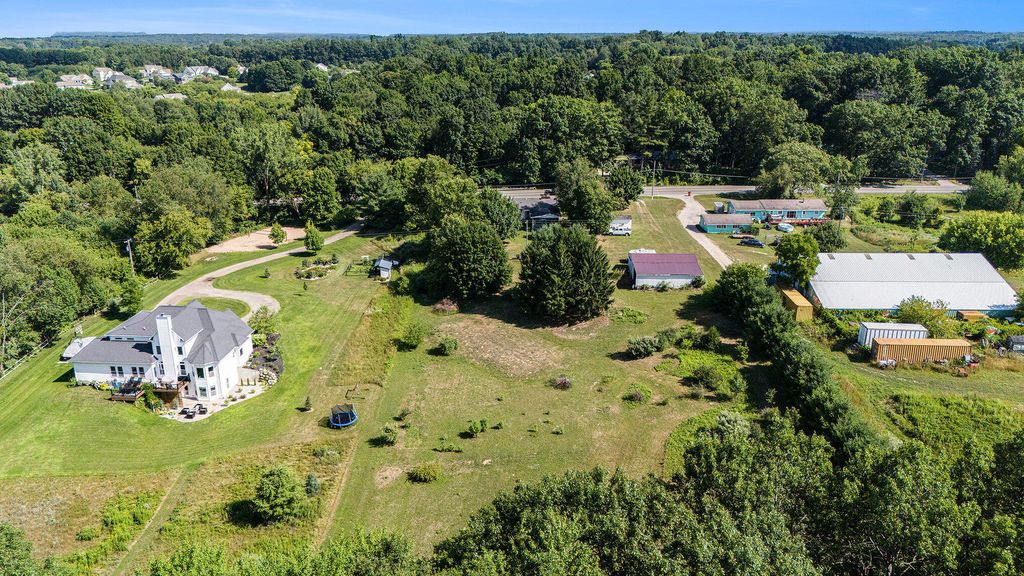 Photo of 6040 10 Mile Road NE, Rockford, MI 49341 (MLS # 25037986)