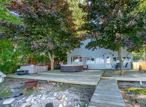 Photo of 8006 Yukon Drive, Beulah, MI 49617 (MLS # 25047783)