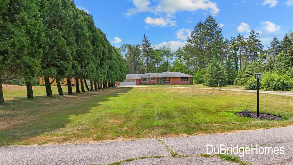 Photo of 311 Honey Creek Avenue SE, Ada, MI 49301 (MLS # 26043398)
