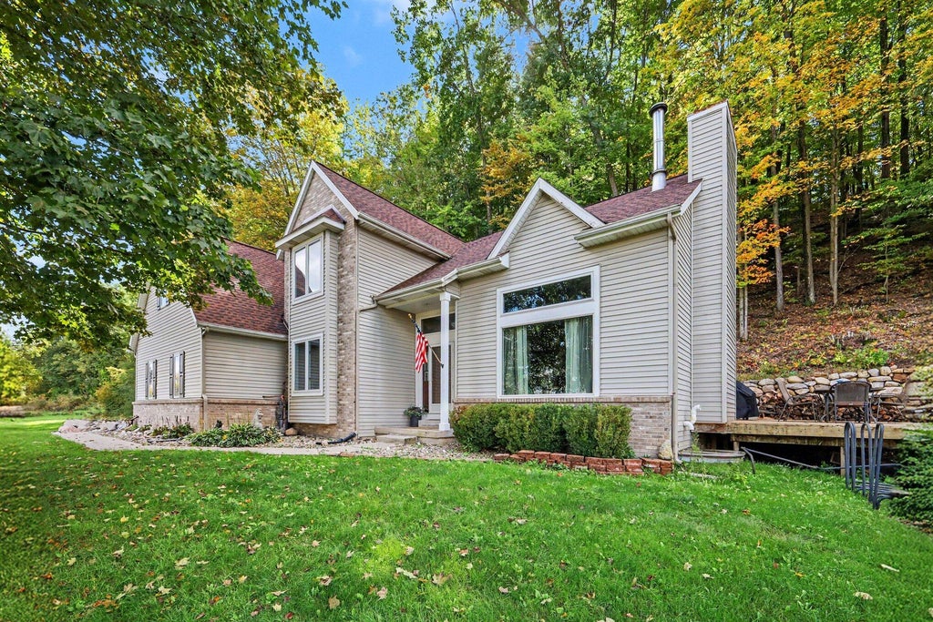 Photo of 8824 Grand River Drive SE, Ada, MI 49301 (MLS # 26048971)