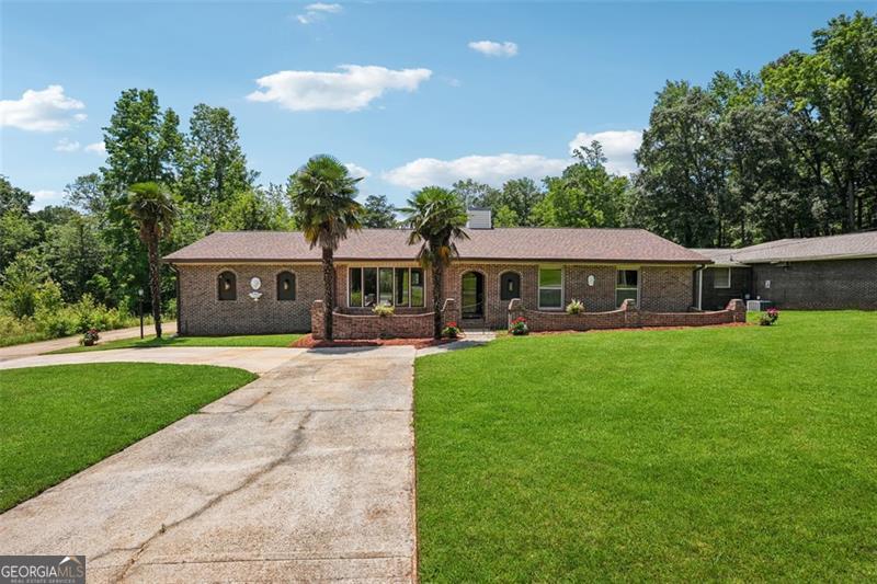 Love different style ? you got it! Great LOCATION? you got it ! You have it all in this beautiful 4side brick home with 3 bedrooms 2 baths Ranch style in the cul-de-sac of very quite neighborhood. This home counts with great upgrades including hardwood floors, granite countertops, New carpet in spacious bedrooms, and more. Chose the best of the area without worrying about busy roads or noisy traffic. Enjoy your backyard for relaxing time or fishing in the beautiful tranquil lake. Check the covered back porch perfect for a cookout or relaxing time as you deserve, that makes it even better. Roof replaced on 2021, New HVAC system on 2024, as septic tank . Oh, and water heater is pretty new too. Double driveway to offer large space to park additionally to the double car garage. Tax records do not show correct sqft. Total 1600 sqft includes additional media room, with dining area as your convenience.