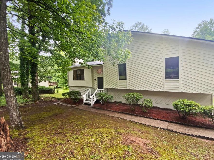 Discover comfort and versatility in this beautifully maintained split-level home! The spacious family room with a cozy fireplace offers the perfect spot to unwind, while the open-concept dining area seamlessly connects to a modern kitchen featuring solid surface countertops and sleek stainless steel appliances. The main level boasts a generous primary bedroom with a private ensuite, along with two additional bedrooms ideal for family or guests. Downstairs, enjoy a fully finished bonus room-perfect for a home office, gym, or media space-plus a convenient two-car garage. Step outside to find not one, but two inviting decks overlooking a large, fenced backyard-ideal for entertaining or simply enjoying the outdoors.