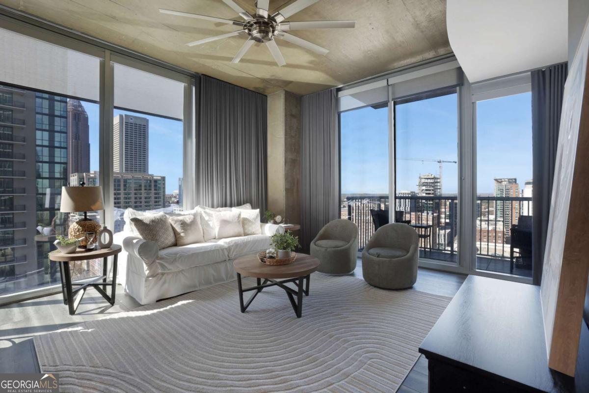 Discover your urban oasis at Viewpoint, situated in the lively heart of Midtown Atlanta. This stunning 17th-floor corner unit features two private bedrooms and two spacious ensuite bathrooms, with floor-to-ceiling windows that flood the space with natural light and showcase breathtaking skyline views, including landmarks like the Fox Theatre and mesmerizing westward sunsets. Recently enhanced with luxurious renovations, the home boasts a modern chef's kitchen with Wi-Fi-enabled appliances, updated cabinetry, and new granite countertops, along with upgrades like new tile, seamless glass shower doors, updated lighting, floating floors, custom blinds and curtains, and more. Each bedroom offers plush carpeting, remodeled bathrooms, and ample storage. The expansive private balcony overlooking Peachtree Street is perfect for relaxing or entertaining, and the unit includes two side-by-side garage parking spaces and a separate storage unit. Residents enjoy premium amenities such as a resort-style pool, outdoor spaces, on-site gym, doorman service, elevator access, and secure garage parking. Located within walking or biking distance of restaurants, shops, MARTA, Georgia Tech, Piedmont Park, and the BeltLine, this move-in-ready home offers a perfect blend of contemporary elegance, convenience, and functionality. Schedule your private showing today!