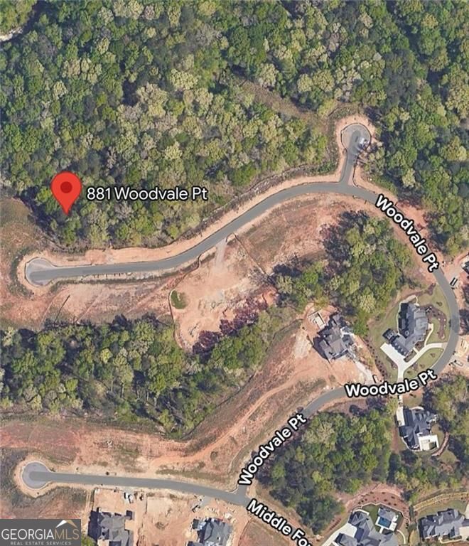 Best lot in the cul de sac! The property at 881 Woodvale Point, Suwanee, GA 30024, is a vacant lot spanning approximately 0.80 acres. Situated within The River Club, a prestigious gated country club community along the Chattahoochee River, this lot offers interior views and is part of the final phase of available lots in the Metropolitan Atlanta area. The community features a Greg Norman-designed golf course, a 10,000-square-foot clubhouse with both formal and informal dining options, The Retreat Spa, eight lighted tennis courts, a large pool with a cabana and waterpark, a fitness center, a children's play area, and a 1.4-mile natural trail along the riverbanks. All homes in this community are custom-built by members of an exclusive builder guild and must meet specific architectural standards. The River Club lifestyle features 650 acres with Greg Norman golf course, 10,000 square feet of dining space (formal and informal), The Retreat Spa, 8 lighted tennis courts with viewing area, large pool w cabana and waterpark, fitness center, kids play area and the coveted 1.4 mile natural trail along the river banks of the Chattahoochee . Please call for private tour or more information.