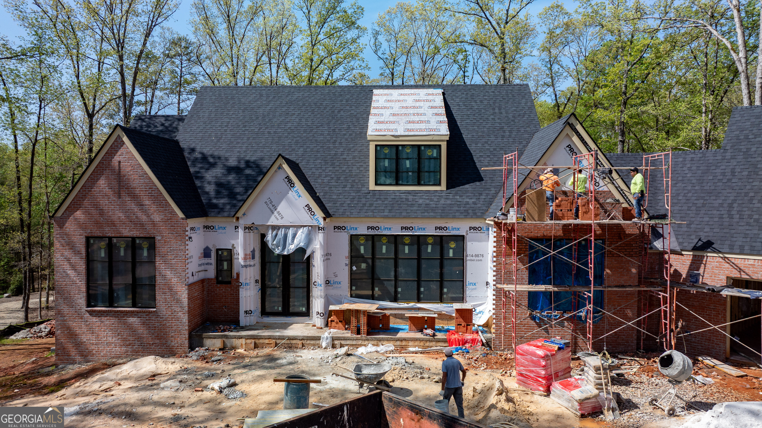 Brand new custom home in the exclusive Richland Pointe at Reynolds Lake Oconee is ready for Spring! This show-stopping property is highlighted by a beautiful open and bright floorplan and a paved path down to a dedicated boat slip. The interior features a chefCOs kitchen with Thermador appliances, custom cabinetry, and stone backsplash overlooking the living area and white oak hardwoods throughout the entire home. YouCOll have easy access to your covered patio through a huge glass sliding door where you'll enjoy peace and serenity while sipping a glass of wine by the wood burning fireplace in addition to the covered terrace level outdoor kitchen for cookouts. The master suite is highlighted by a double vanity, separate garden style tub and shower, and a generous over-sized closet. Escape to your basement to hang out with a fully equipped bar area for movie night, the big game, or additional guest space. You can also customize the loft area above the garage for additional entertaining or an in-law suite. This house has it all, and there's still time to do some customizations and be in your new home by summer!