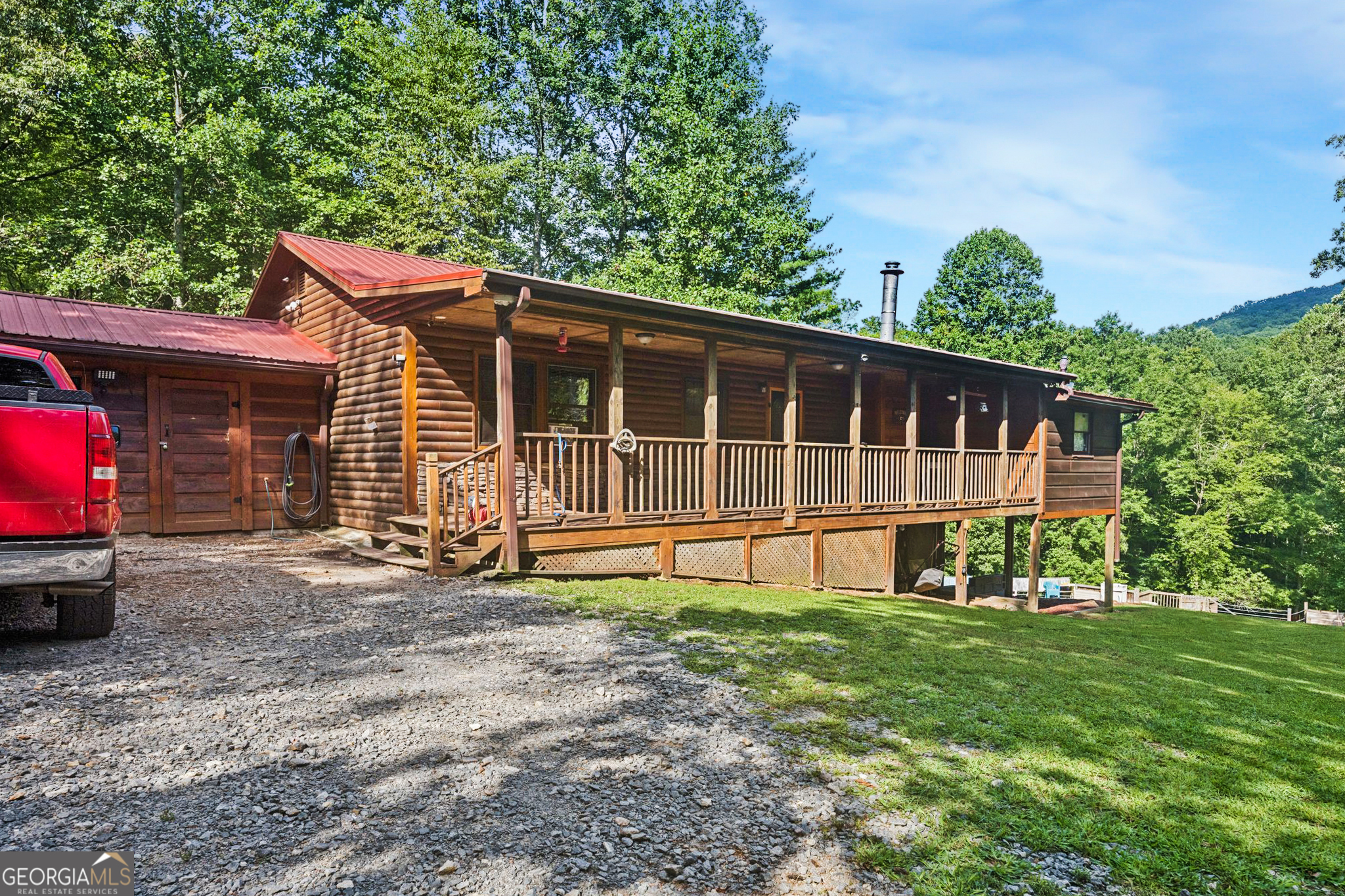 This charming home boasts rustic appeal with all-wood interiors, vaulted ceilings, and a cozy wood-burning fireplace that anchors the main living area. The open-concept layout includes 4 bedrooms and 2 full baths on the main level, with a fully finished walk-out basement. Step outside to enjoy sweeping mountain views, a private above-ground pool with a new liner, and a rare natural mineral spring on the property. The exterior features durable log siding, a metal roof, and a large, level yard perfect for outdoor activities, gardening, or relaxing in peace. No HOA or restrictions, making this an excellent option for full-time living, vacation getaway, or income-producing rental. Additional highlights include central HVAC, propane and wood heating, well water, septic system, and plenty of parking at kitchen level for convenience. Located just minutes from Blue Ridge, Lake Blue Ridge, and countless hiking and outdoor recreation opportunities, 711 Arp Rd is your gateway to tranquil North Georgia mountain living.