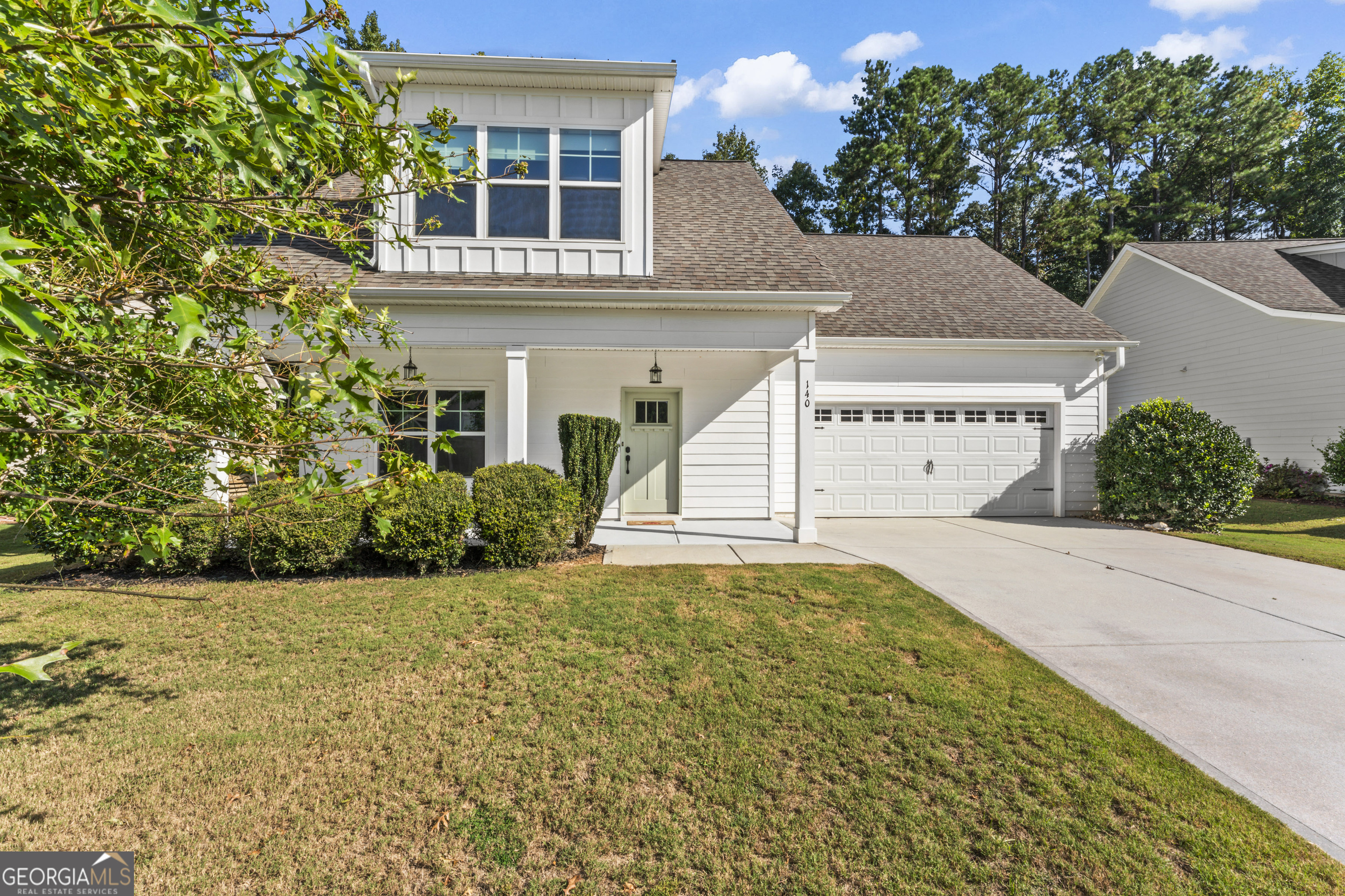 Better than new! This spacious 5-bedroom, 4-bathroom home is tucked inside a well-cared-for subdivision just minutes from historic, picturesque downtown Senoia-famous for its charming shops and delightful restaurants. Plus, golf cart paths connect the neighborhood directly to town for easy access. And in the other direction, you're only a few minutes from all the conveniences of Peachtree City. Step inside to a sunny, open floor plan with beautiful hardwood floors in the main living areas. The heart of the home features a bright kitchen with stainless steel appliances (fridge included!), flowing seamlessly into the living and dining spaces. The owner's suite is on the main level, along with a second bedroom and full bath-ideal for guests, family, or a home office. Upstairs, you'll find a bonus room, along with three large bedrooms and two full bathrooms, giving everyone space to spread out. A washer and dryer are also included, making this home move-in ready. With its thoughtful layout, stylish finishes, and unbeatable location between downtown Senoia and Peachtree City, this home truly offers the best of both convenience and charm.