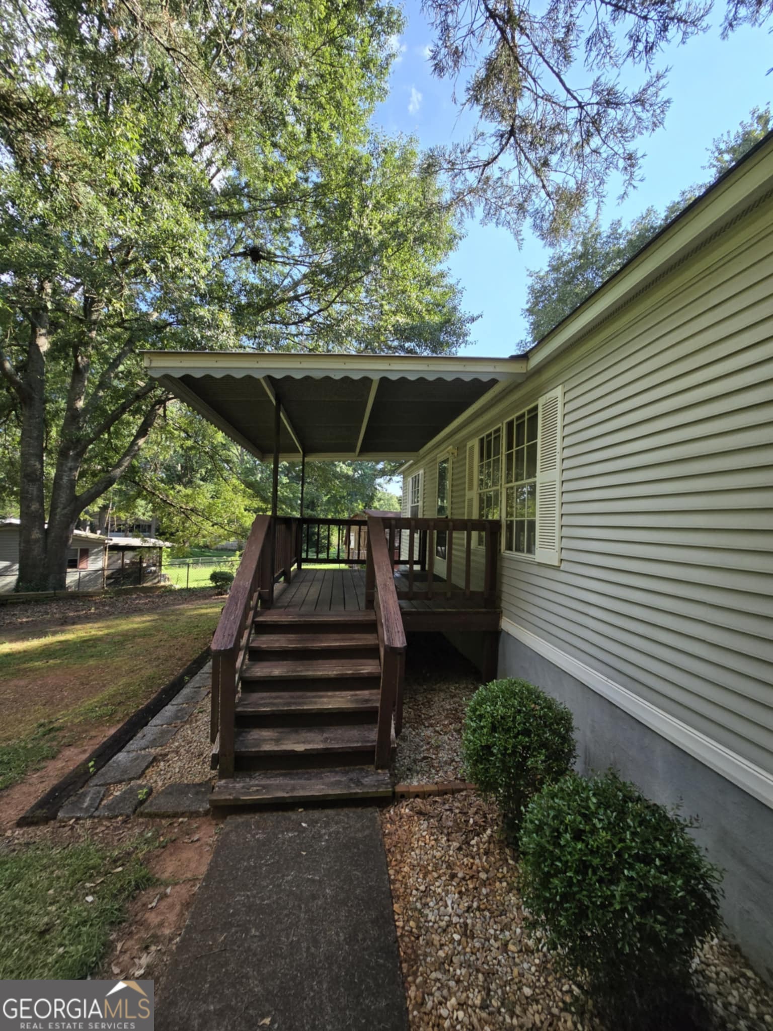 This versatile property offers a spacious 0.5-acre lot with ample green space, perfect for outdoor living. Enjoy the peaceful street and the private, fenced yard, complemented by a convenient storage outbuilding. With endless potential, this home is ideal for a first-time buyer or a savvy investment! PLUS NO HOAs.