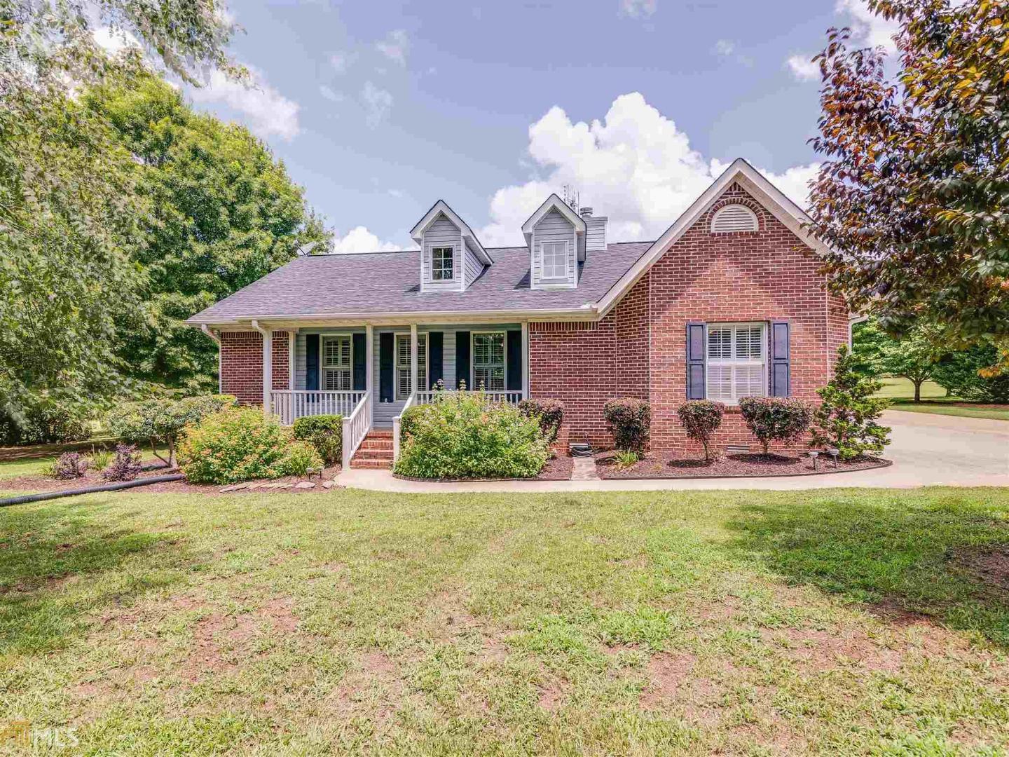 Well cared for, immaculate and ready for you to love this 4 side brick ranch on 6.5 acres in Jackson. With an easy commute to McDonough, Jackson and the lake, this family home is sure to impress with it's heart of pine hardwood flooring throughout, the open and bright family room, and a 2 car detached garage with workshop and bonus room. The kitchen is spacious, the family room has a 2 story ceiling with tons of natural light, master is roomy and separate from the secondary bedrooms. Enjoy watching the deer on the over sized back deck. The detached garage has so much potential with the extra large room and storage upstairs. The yard is fenced including gated driveway. This is a wonderful place to call home.
