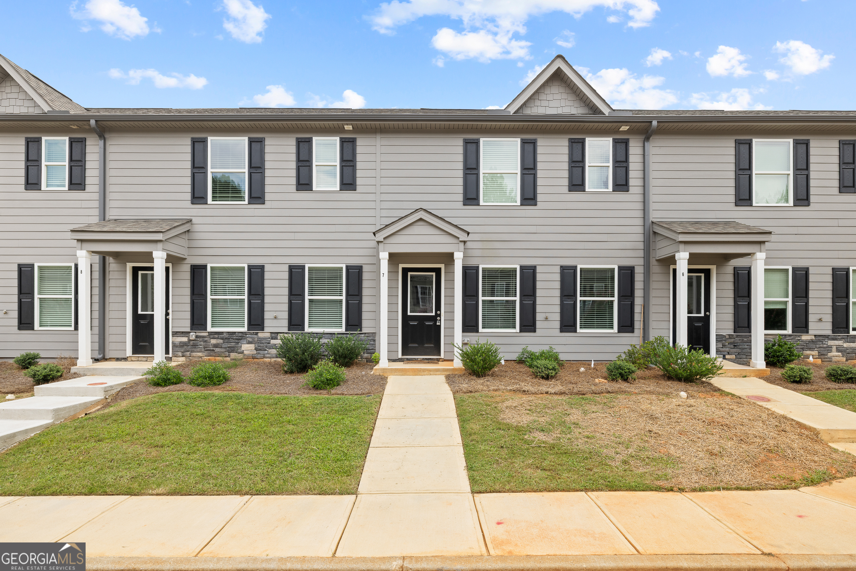 Brand New 3 Bedroom Townhome in the Heart of Lake Oconee! Welcome to 100 Lena Lane, Unit 7 - a stunning new construction 3 bedroom, 2.5 bath townhome perfectly situated near everything Lake Oconee has to offer. Step inside to find an open-concept floor plan featuring a bright, airy living space, a modern kitchen with quality finishes, and a spacious dining area perfect for gathering with family and friends. Upstairs, you'll find a generous primary suite with a walk-in closet and spa-like bath, along with two additional bedrooms and a full bath. A convenient half bath is located on the main level for guests. Enjoy the ease of low-maintenance living in a community designed for comfort and style. Located just minutes from shopping, dining, marinas, golf, and all the recreational activities that make Lake Oconee a sought-after destination. Whether you're looking for a primary residence, weekend retreat, or investment property, this townhome checks all the boxes.