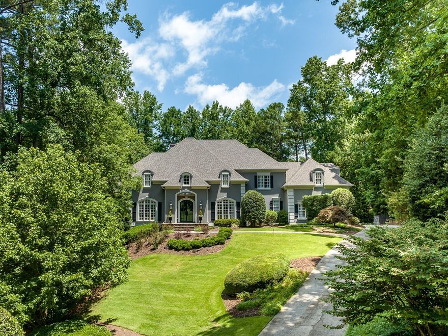 Gorgeous Luxury Estate Home Located in an Exclusive Private Cul-de-Sac Enclave off Mount Paran Road and Situated on 1+ Acre Lot with Owner's Suite on Main and Beautiful Backyard with Pool! Perfection describes every detail in this masterpiece with thoughtfully considered architectural details, an abundance of natural light, open floor plan, front and rear stairs, spacious rooms, high ceilings, impressive woodwork and moldings, hardwood floors, custom built-ins, plantation shutters, and vaulted ceilings. Elegant and expansive two-story entrance foyer opens to banquet size dining room with 3 Butler's pantries, paneled study with bookcases and coffered ceiling, two story fireside great room with floor to ceiling windows. Walk out to the covered porch with outdoor kitchen, grill, and stunning pool and spa with patio terrace in a completely private and fenced backyard! Chef's kitchen with painted cabinetry, 2 islands, breakfast bar, stone countertops, 2 walk-in pantries, professional stainless-steel appliances with Wolf gas cooktop, double ovens, and warming drawer, all open to keeping room with fireplace and bright breakfast area. Side entrance mud room from the 3 car garage. Oversized owner's suite with sitting area, fireplace, and private access to deck and pool area, luxury marble bath with dual vanities, jetted tub, separate shower, and his/hers' walk-in closets. Upper level includes open landing area, 4 secondary bedrooms, 3 are ensuite and one with hall bath, cedar closet and bonus room. Fabulous finished terrace level includes a game room with full bar, family/media room, exercise room, full bath, and a good-sized unfinished area for storage or future expansion. Ideal Sandy Springs/Chastain location offers great proximity to private and public schools and is located in the award winning Heards Ferry and Riverwood International Charter School Districts, convenient to shopping, dining, Chastain Park, entertainment, and quick access to Buckhead! Truly A Rare Find for the Best in Entertaining and Family Life! New Roof Installed June 2023