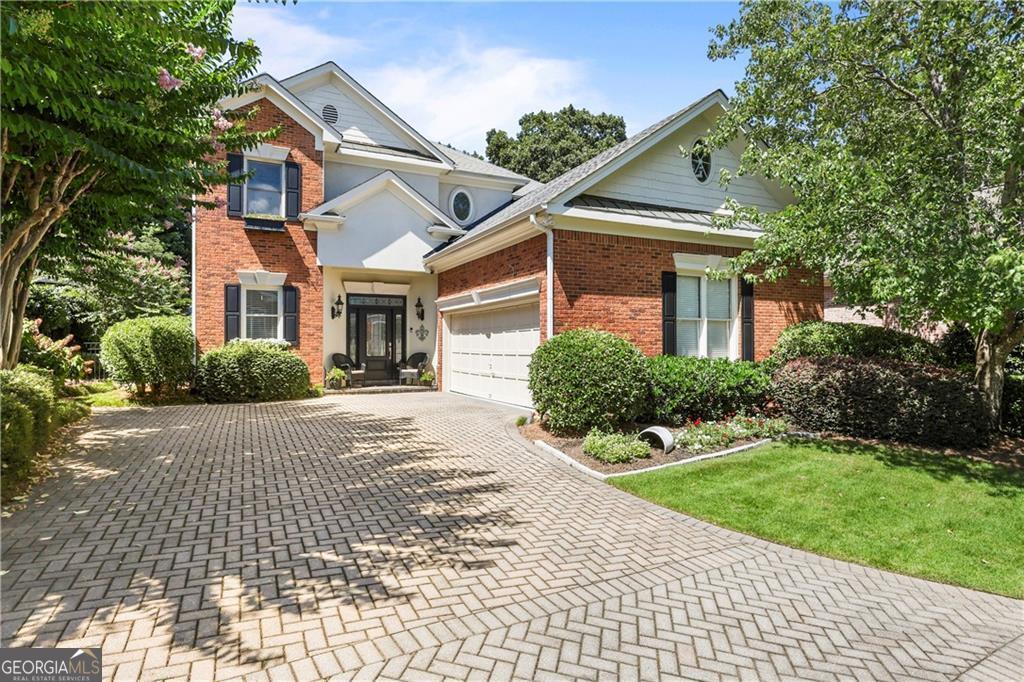 Nestled within the exclusive gates of Brookhaven's coveted Arbor Trace, this luxurious 4-bedroom, 2.5-bathroom single-family residence is a haven of sophistication and comfort. The cobblestone streets lead you to a home that boasts soaring ceilings and a flood of natural light, accentuating a wide-open floor plan tailored for the most discerning of buyers. A hard to find Master on Main retreat offers a serene escape, complete with a cozy fireplace, a spacious sitting area, and an intricate multi-trayed ceiling. The recently renovated spa-like Master bath beckons with its modern tub, frameless glass shower, and chic finishes. Throughout the home, rich walnut hardwood floors pave the way to a chef's kitchen featuring custom cabinets, a generous island, and top-of-the-line stainless appliances. Entertaining is a delight in the spacious Family Room, adorned with a fireplace and custom built-ins. The separate dining and living room with a wall of windows and two-story ceiling provides an elegant space for all gatherings and holiday parties. Ascend to an upstairs with 3 additional spacious bedrooms, Loft, and bonus area, equipped with built-in shelving, ideal for a sophisticated home office. Architectural design touches, including elaborate molding and arched doorways, add to the home's unique and wonderful charm. Outside, an extended covered patio opens to a private, fully fenced backyard oasis, showcasing beautiful green spaces, professional landscaping, flowers, and stone details-a true luxury living experience. The location can't be beat. Minutes from the area's best dining, shopping, and entertainment, including, Dresden Shops, Town Brookhaven, Buckhead, MARTA, and easy access to I-85 and GA 400. Under 1 mile to Phipps Plaza and Lenox Mall, plus Lenox Park is just across the street, offering paved walking trails, duck pond, and dog park. Very close to access the new CHOA Hospital, Emory, and CDC, and all the amenities Buckhead and Brookhaven have to offer.