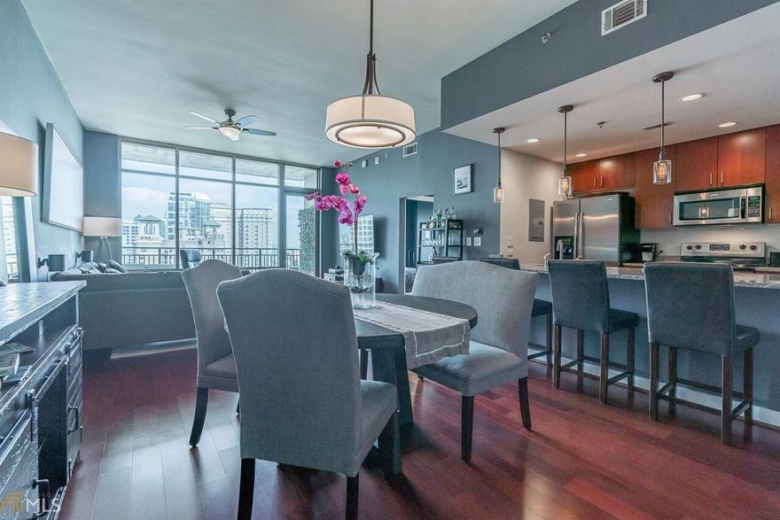Gorgeous corner unit filled with natural light from the floor to ceiling windows is high rise living at its finest! This spacious 1 bedroom/1 bathroom open floor plan features incredible northern and eastern views of The Fox Theatre, Piedmont Park and Stone Mountain in a boutique building that fronts Peachtree St. Enormous private walk-out balcony, 10' ceilings, hardwoods, Nest thermostat, new dishwasher, granite counters, large pantry plus a huge walk-in closet with laundry. 24-hour concierge plus resort-style amenities include seasonally heated saltwater pool, lounge, fitness center & covered grilling/dining area with fireplace. Easy access to 75/85 and a short walk to the Fox Theatre, GA Tech, Beltline, Emory Hospital Midtown, and Ponce City Market! One of the city's top-rated vegan restaurants is located in the building. Planned upcoming common area renovation. Tour this home from anywhere by clicking on the virtual tour link which leads to the 3D virtual reality tour.