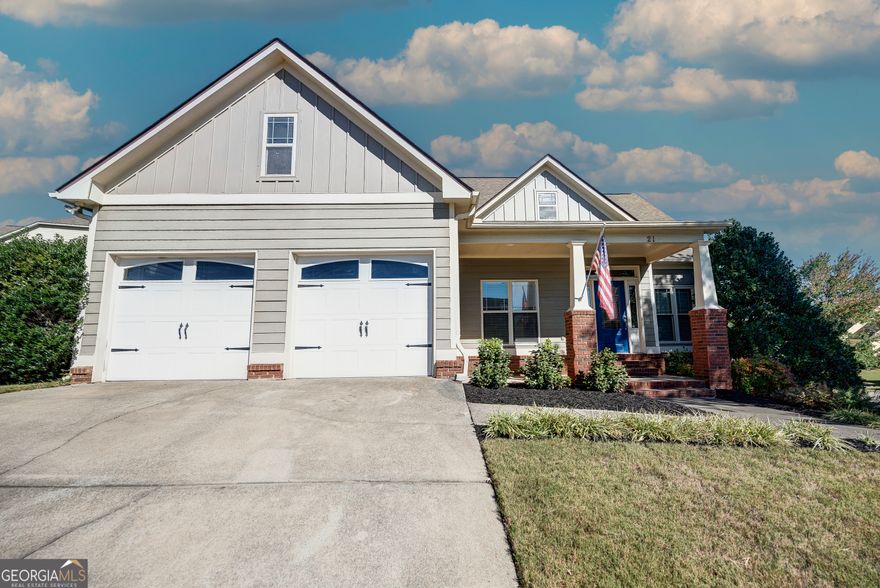 CHARMING CRAFTSMAN WITH IN-LAW SUITE AND FULL-SERVICE SALON SETUP IN POOLSIDE NEIGHBORHOOD! Situated on a LUSHLY LANDSCAPED CORNER LOT, this meticulously designed residence offers the perfect blend of timeless architecture and modern comfort. As you approach, you will be mesmerized by the quintessential Craftsman curb appeal of the facade, with handsome CEMENT SIDING and classic BRICK accents. Guests arrive at the front entry to be greeted into the warm and welcoming atmosphere of the main level footprint. The living room boasts SOARING CEILINGS and a romantic, GAS LOG FIREPLACE, providing a cozy ambiance to snuggle in on those chilly winter eves. EAT-IN KITCHEN features CERAMIC TILE FLOORING, STAINLESS APPLIANCES (including REFRIGERATOR), and handy PANTRY, and opens to a partially-covered PORCH, overlooking the FENCED BACKYARD - a laid-back setting to sip morning brew or host Fall gatherings! A spacious DINING AREA is also in place for more formal meals, and is open to the living room in a flawless flow. The generous OWNERS SUITE provides a peaceful escape, and is equipped with TRAY CEILINGS and WALK-IN CLOSET, as well as a spa-like ensuite with DUAL VANITY, JETTED TUB, and SEPARATE SHOWER. The secondary bedrooms on the main level are also generously-sized, and share a hall bath with tub/shower combo. The LOWER LEVEL could be utilized as a future IN-LAW SUITE. Currently in place is a 2ND LIVING ROOM with built-ins; FULL-SERVICE SALON AREA; BEDROOM; FULL BATH with stall shower; LARGE GAME ROOM; and STORAGE ROOM. (The lower level is not serviced by HVAC at the present time.) Located in a PICTURESQUE NEIGHBORHOOD with COMMUNITY POOL and PLAYGROUND in ADAIRSVILLE SCHOOL DISTRICT, convenient to I-75, schools, shopping, dining, and more! Welcome Home to 21 Barnsley Forest.