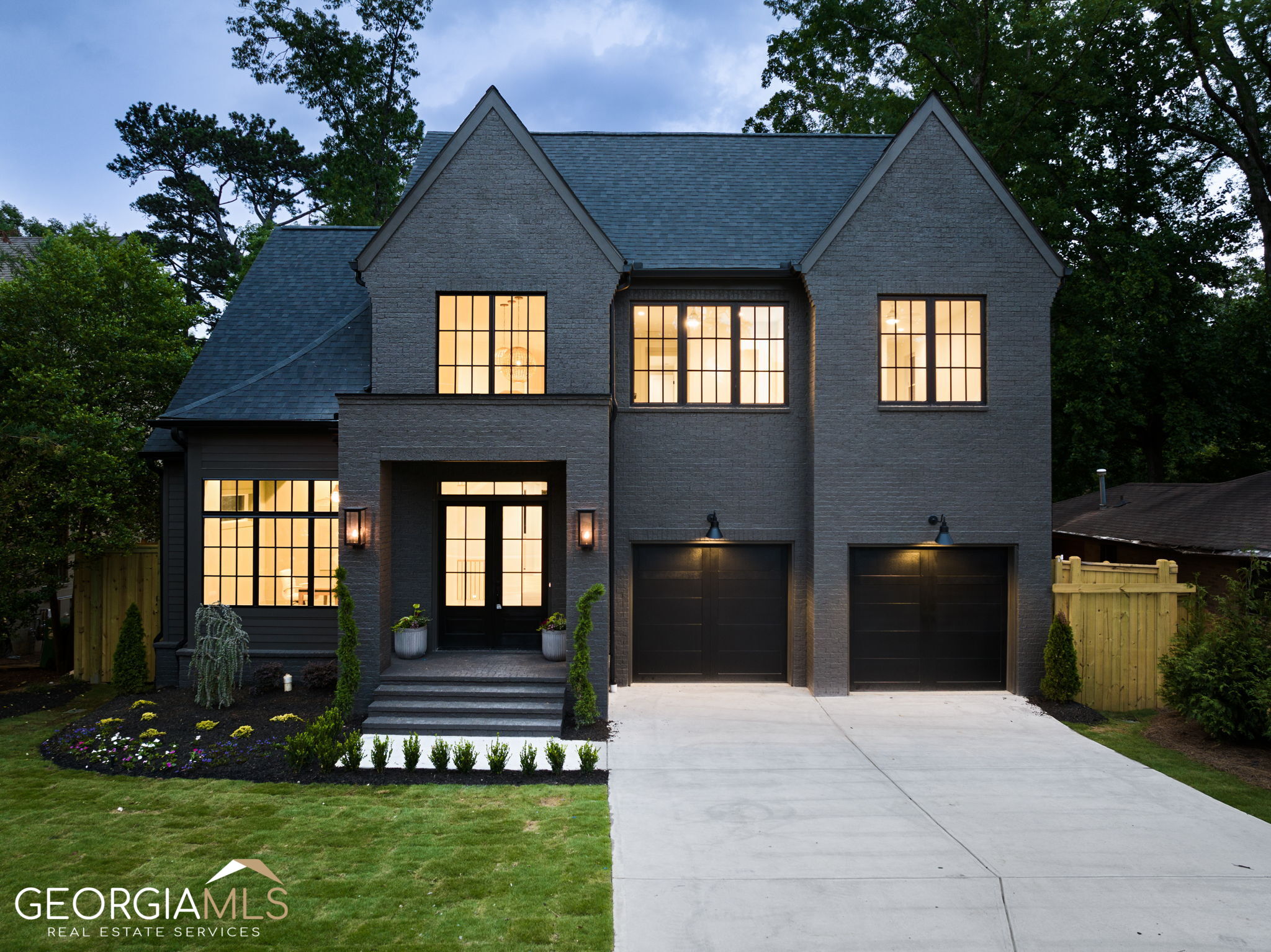 Nestled on one of the most desirable streets in Brookhaven's Ashford Park neighborhood, this stunning brand-new construction home with a full unfinished basement offers endless possibilities to make it your own. As you step into the 2-story foyer, you'll be greeted by beautiful hardwood floors, high ceilings, and an abundance of natural light flowing through the large windows. The main level features a true office, bed/full bath + a half bath. The open-concept design provides an exceptional indoor/outdoor living space that is an entertainer's DREAM! The spacious fireside family room features built-ins for storage and Western sliding doors which leads you to the covered deck with fireplace. The gourmet chef's kitchen boasts a large island with seating, stainless steel appliances, quartz countertops, custom cabinetry, and a jaw dropping scullery complete with a sink, ice maker, and custom cabinetry for all your storage needs. The kitchen flows to the vaulted natural light filled breakfast room with a second set of Western sliding doors + large wall of windows. As you ascend the staircase to the second level, you'll find the master suite is complete with vaulted ceilings and a luxurious spa-like bathroom which includes double vanities, frameless tiled shower, and two large closets + the large laundry room with custom cabinetry connects to the master bathroom for convenience. The remaining secondary bedrooms are generously sized, offering ample closet space (one en-suite bedroom and two sharing Jack and Jill). Enjoy privacy from the large, flat backyard lined with 18-foot trees + a patio on terrace level! Hardwoods throughout the home. ROOM FOR A POOL! Conveniently located in the heart of Brookhaven just moments to all of the shops & restaurants, and entertainment options Brookhaven has to offer!