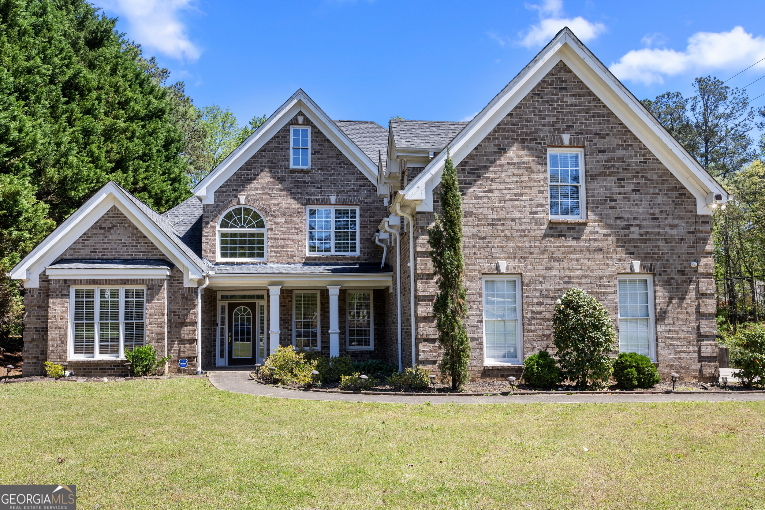 Welcome to your dream home at 774 Mary Ann Dr NE in the heart of Marietta! This beautifully maintained residence offers a spacious and stylish kitchen complete with sleek countertops, a chic tiled backsplash, stainless steel appliances, and ample cabinetry. The open-concept living area features a cozy fireplace, ideal for relaxing or entertaining guests. Retreat to the serene primary suite with a private ensuite bath, dual vanities, and a generous walk-in closet. Additional bedrooms are well-sized with ceiling fans and great closet space. Step outside to enjoy a fenced-in backyard with a lush lawn and patio. Don't miss this incredible opportunity to make this stunning home yours.