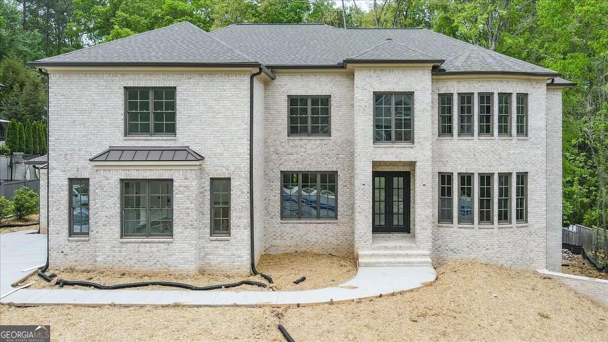 Never before built floorplan features 6 bedrooms, all with ensuite bathrooms with 4 full showers and two tubs, two kitchens, optional elevator, home theater, prewired for EV charging in the garage, and situated on a quiet, cul-de-sac lot in sought-after Sibley on Paper Mill. This still-under-construction home offers high-end finishes and an opportunity to work with one of East Cobb's best builders. Crafted with unparalleled attention to detail and flooded with natural light, this custom-built home showcases sophisticated finishes and stunning amenities that provide the functionality that a busy family needs in today's world. Amenities such as an inspiring main floor office with custom trim details including coffered ceilings, floating shelves and a wall of windows overlooking the peaceful setting. From the grand coffered ceilings in the fireside family room vaulted and beamed fireside keeping room...there is no shortage of space to entertain and relax. The open and expansive chef's kitchen comes adorned with top-of-the-line Thermador appliances, quartz countertops, custom floor to ceiling cabinetry and large pantry outfitted with wooden shelving and a place for a second refrigerator. Other features include a convenient Main level guest suite plus additional powder room that is perfect for extended family that prefers a stepless stay. The second level features a generous-sized owner's suite with fireside sitting room, extensive moldings, 2 walk-in closets, soaking tub, oversized shower and multiple vanities. Exploring further you'll find 3 very large bedrooms each with their own unique features and details that make each one special along with ensuite baths for a total of four bedrooms and four full baths upstairs. The terrace level comes finished with main-level quality upgrades such as a second kitchen, family room, bonus space, guest suite, second home office, powder room and home theatre. The finished patio offers extra outdoor living space in addition to the spacious deck. The backyard is fully fenced and features room for a pool while still offering plenty of usable yard for play and other recreation. This is an excellent time to customize your selections with one of the most distinguished and reputable builders in East Cobb. Your new elevated lifestyle awaits in this swim/tennis community that's walking distance to Sope Creek Elementary, Sope Creek Trails and more...and only a short distance to I-75, The Battery, Buckhead, Midtown, Pace, Walker School and more. A convenient location at an incredible value!