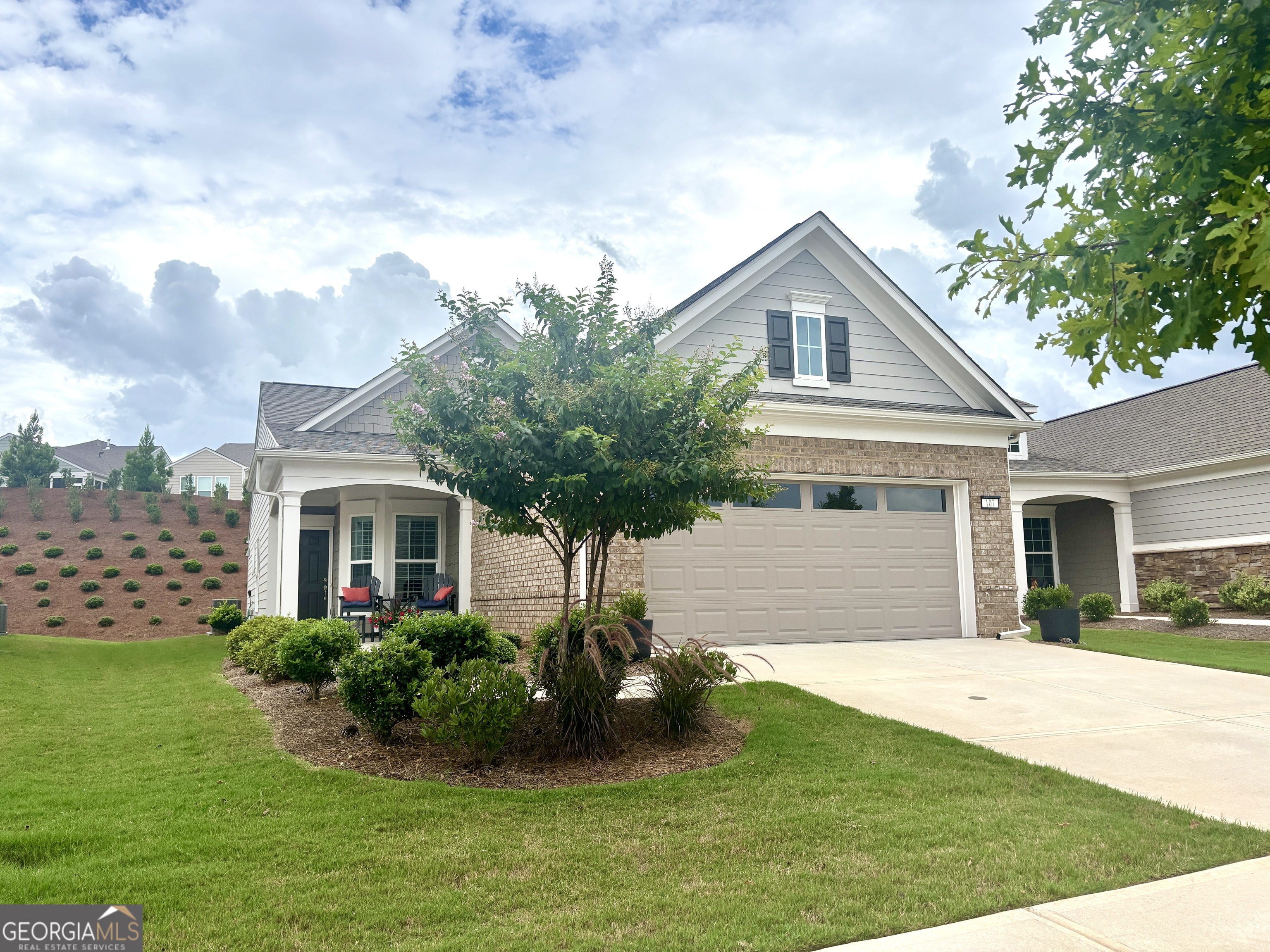 Imagine starting your mornings with coffee on a covered lanai, surrounded by the peaceful setting of one of Georgia's most welcoming 55+ communities. This beautiful 2023 Taft Street home isn't just a house-it's a lifestyle! Step inside and be greeted by an open, airy layout filled with natural light, timeless plantation shutters, and stylish upgraded flooring throughout. The heart of the home is the designer kitchen, where friends and family will naturally gather around the oversized quartz island. With white soft-close cabinetry, roller shelves, and stainless steel appliances, this kitchen is as functional as it is beautiful. Your owner's suite is a true retreat, featuring a tray ceiling, large walk-in closet, and a spa-like tiled shower with bench. There's also a flex office space-perfect for reading, hobbies, or working from home. And it doesn't stop there! The extended garage is a dream for storage and projects with epoxy flooring, custom-built shelving, attic access, and added security features. At Sun City Peachtree, you'll enjoy resort-style living every day-an 18-hole golf course, clubhouse, pools, pickleball, fitness center, walking trails, social clubs, concerts, and more. This is more than a home. It's the active, low-maintenance, fun-filled lifestyle you've been waiting for. Come see why 107 McKay Drive is the perfect place to call home.