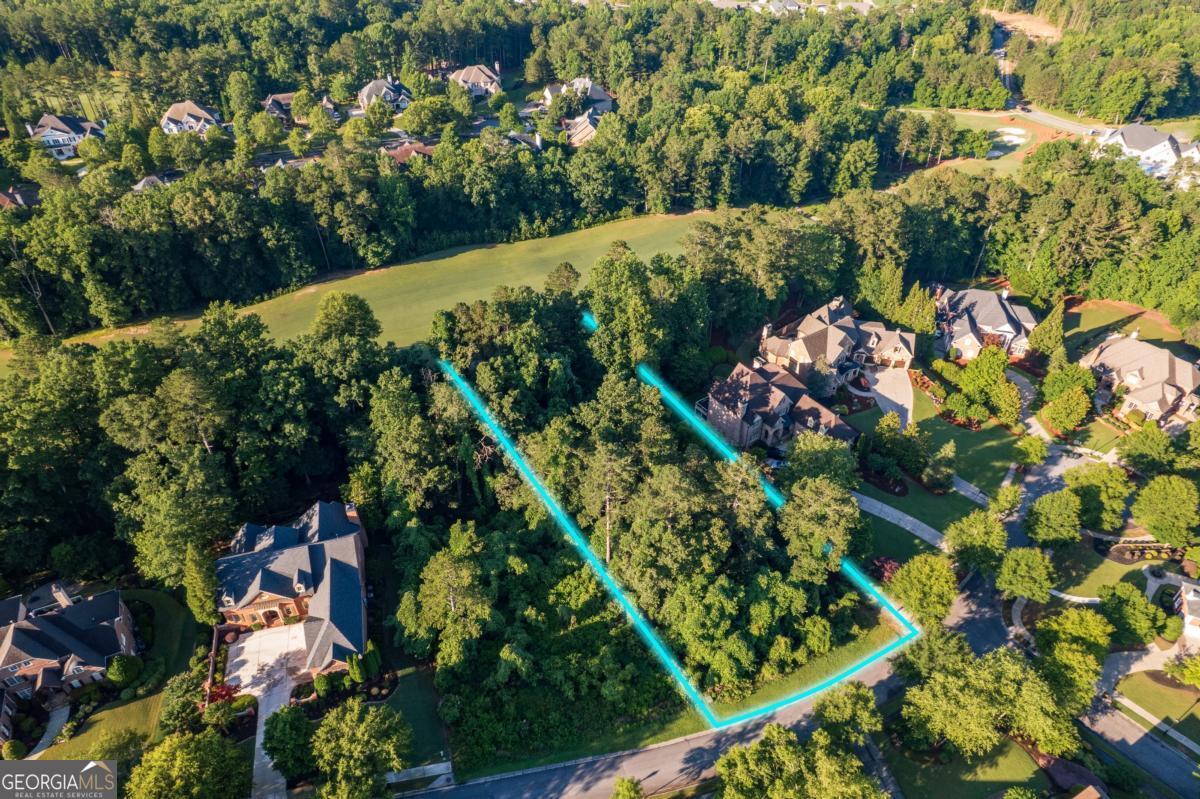 Welcome to your dream golf course lot in the prestigious Governors Towne Club, located in Acworth, Georgia. This exceptional homesite backs directly onto the 8th fairway of a world-class 18-hole golf course, masterfully designed by two-time U.S. Open Champion Curtis Strange-a true paradise for golf enthusiasts. Governors Towne Club is an exclusive, 24/7 gated community offering resort-style living at its finest. Residents enjoy access to an impressive array of amenities, including: A full-service clubhouse ideal for hosting events, State-of-the-art health and fitness center, Day spa, Three on-site restaurants, Aquatic center with competition pool, Children's splash park and waterslide playground, Tennis courts with pro shop,Pickleball, basketball, and baseball facilities. This is a rare opportunity to build your custom dream home on a spacious lot nestled within this luxurious setting. Please note: the sale is for the lot only. The building images shown are conceptual renderings provided by Elevation Building Company, one of the community's premier homebuilders. A club membership is required and a one-time initiation fee of $30,000 is included in the sale price. Golf memberships are also available. Seller is highly motivated. Bring all offers to the table. I'd be happy to personally walk you through the property. Schedule your private tour today