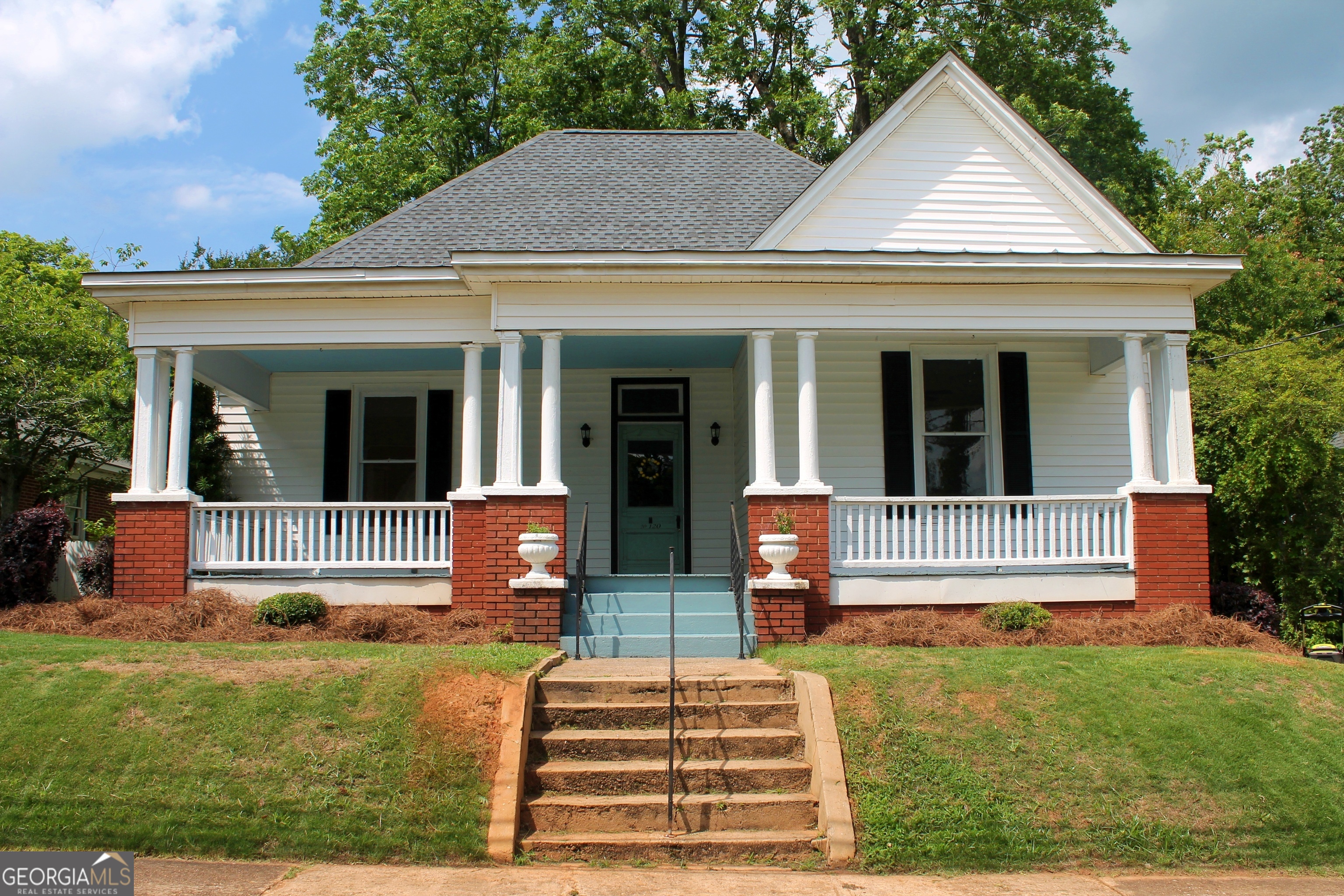 Experience life in the heart of Barnesville! This lovely home built in 1913 offers the best of both worlds: the charm of a historic property with the modern conveniences that make life comfortable. Flexible floor plan offers 2 or 3 bedrooms and one and a half baths. High ceilings, lots of windows, and a wide central hallway make the interior bright and airy! The large front porch extends a welcome to friends and neighbors, and provides a spot for morning coffee and evening gatherings. Inside, the original heart pine flooring has been professionally restored. In areas where there was damage to the floor, antique heart pine was sourced to provide a consistent look, appropriate to the age and style of the home. New luxury vinyl plank flooring was installed in the kitchen and keeping room areas, as well as in the half bath. The entire interior was professionally painted, with original plaster walls patched and sanded. The original crank doorbell and mail slot showcase the home's rich history and excellent craftsmanship. The large, private back yard has plenty of room for all sorts of uses, from creating a gorgeous flower garden to having space for outdoor games. An outbuilding provides ample additional storage for gardening supplies or hobby items. This home is located within easy walking distance to the Lamar County Public Library, the Lamar County Courthouse, several churches, and dining and shopping options. Sellers have engaged licensed contractors to perform all the electrical, plumbing, painting, and structural work on this property. Come see this historic beauty in person and be a part of her next hundred years! Seller holds an active real estate license in Georgia.