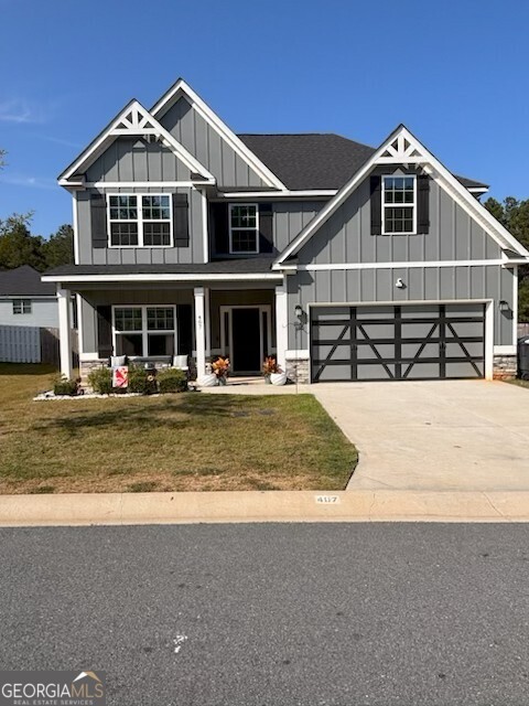 Discover this impeccably maintained residence in a prime Perry location. Boasting five generously sized bedrooms and three luxurious bathrooms, this home offers ample space for relaxation, entertaining, dining, studying, and restful living. The main level welcomes you with an elegant entry foyer, a versatile guest suite with a private full bath, and a spacious Media Room. The gourmet kitchen showcases a large center island and a bright breakfast area that seamlessly connects to the Great Room, complete with a wood-burning fireplace. A formal dining room and a 10x10 covered patio enhance the home's appeal for both indoor and outdoor gatherings. Upstairs, the expansive Owner's Suite includes a massive walk-in closet, dual vanities, a separate shower, and a garden tub. You'll also find three additional bedrooms, a third full bathroom, and a convenient laundry room with direct access to the Owner's Bath. Modern smart home features include the Qolsys IQ 2 Panel, front entry lighting, a touchless video doorbell, and the Genie Aladdin garage door opener. This property is 100% USDA eligible. A must-see opportunity in one of Perry's most desirable neighborhoods.
