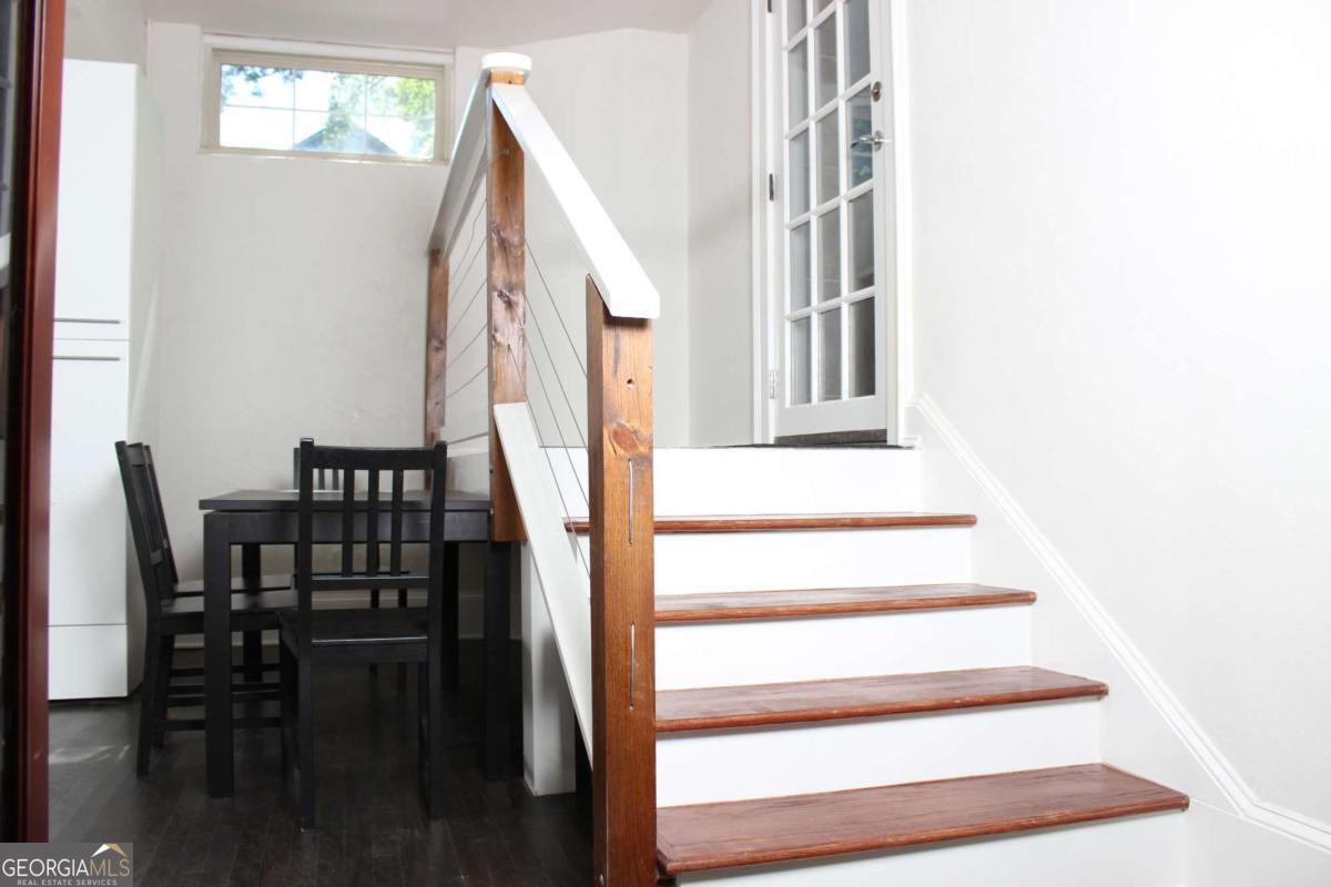 Welcome Home! This 1300 square foot apartment is conveniently located in Midtown Atlanta near GA Tech, 14th street, and Northside Drive moments from the West Midtown restaurant district and I-75/ I-85. It's a furnished 2 bedroom/ 1 bathroom basement apartment with its own private entrance and it includes utilities. The eat in kitchen is equipped with a stove, spacious refrigerator and granite countertops. Amenities include in-house washer and dryer, a pool table in the living room as well as a furnished living room with couch and tv. You'll find each bedroom to be incredibly spacious and each will also have a tv mounted to the wall along with a walk-in closet. All applicants must submit a background check along with their application. Upon approval there will be a refundable security deposit due (the equivalent of one month's rent).