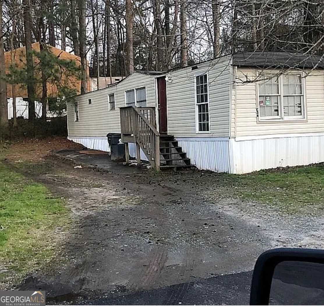Affordable Housing Opportunity: Move in ready! Stop paying rising rent costs and own this spacious 2 bed x 1 bath home with a huge lot size. Tara MHP is an all-age manufactured housing community providing comfort and affordability for individuals and families. Conveniently located within minutes of 75 South and 15 minutes from downtown Atlanta, with a 2-minute walk to the transit bus stop. The community is surrounded by restaurants, stores, and a hospital. Lot rent is $575 per month plus water and trash. The home is totally electric, and applicants must pass a criminal background check with the park manager. Title is in hand, and you have the option to stay in the park or relocate the home. All appliances included with sale. Seller is Motivated and willing to negotiate.