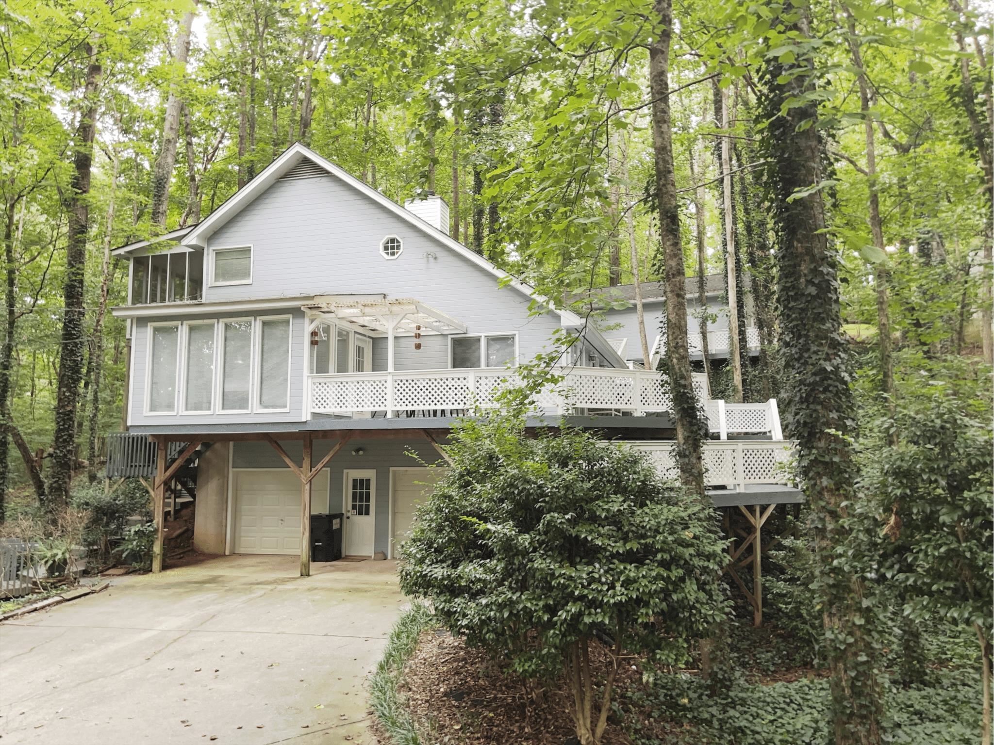 Do not miss this incredible rental in the Lake Lanier Community, Surfside Club Estates! Fully Furnished and Ready to Rent. 2 Bedrooms and 2 Bathrooms in the main home with additional room for beds in the detached garage with TV, Fridge, and Rec Space. 2 Car Garage, private, wooded lot, and a great deck for hosting. Two story family room, Open Concept, Sun Room, and Two Fireplaces. Master Bedroom has it's own fireplace and private screened in deck. So much room in the detached garage for game room, rec room, additional bedroom, anything you need. Quiet neighborhood and friendly neighbors. Ideal Opportunity for Corporate Lease or Lease for Work.