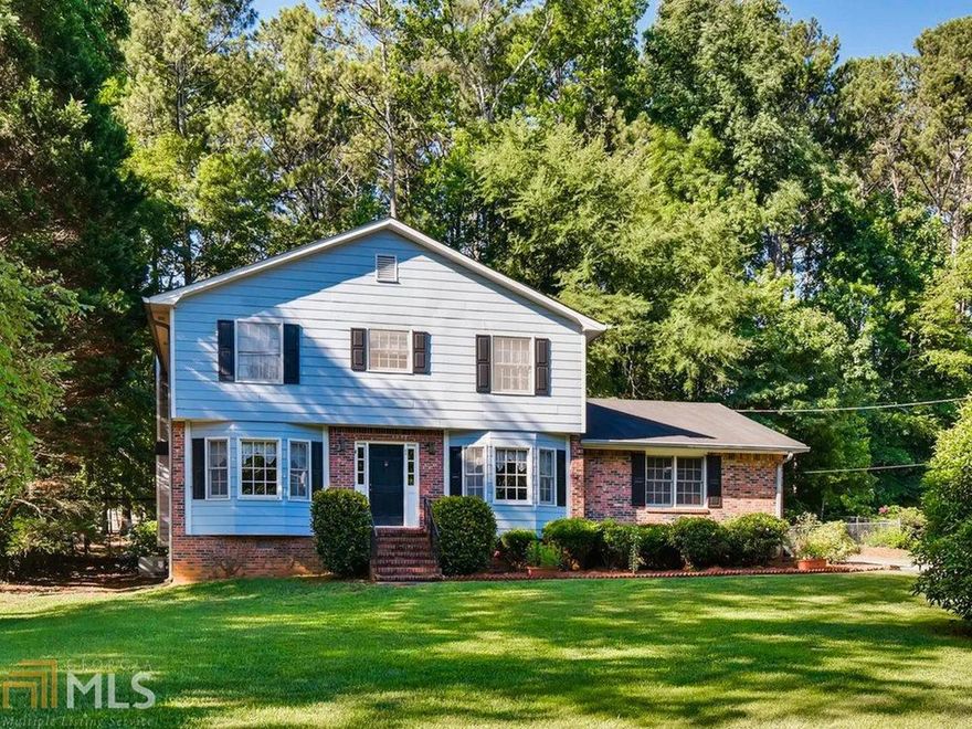 Picturesque 4 bed/2.5 bath 2 story home in quiet Roundtree Subdivision! This family friendly home has been very well taken care of by one family for the last 40 years. It has a newer stove, water heater and new carpets throughout. It has a formal living room with a bay window as well as a den with a beautiful large red brick fireplace that overlooks the large fenced in back yard. Back yard has a dog run to separate your beautiful garden area from the dog area! Kitchen has an abundance of cabinet space and a breakfast nook attached to it. Large bedrooms! No HOA! Prime location and a short drive to any grocery and shopping you can think of. Don't hesitate - this home is in award-winning Parkview HS!