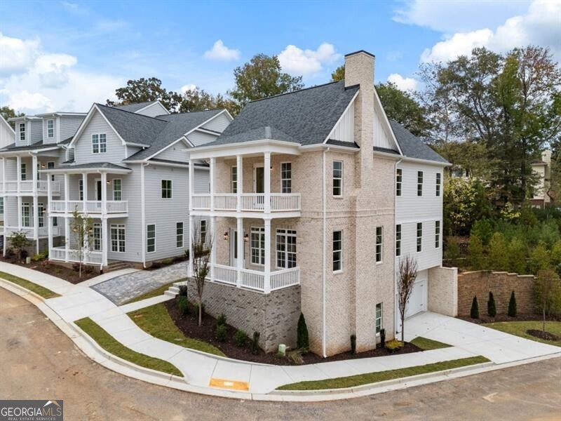 WWelcome to Parkside Roswell, a stunning new construction community ideally situated across from East Roswell Park-a 40-acre haven offering walking trails, tennis courts, sports fields, a dog park, playgrounds, a frisbee golf course, and more. The community features a mix of thoughtfully designed townhomes and single-family residences conveniently located in Roswell near Johns Creek and Peachtree Corners to enjoy numerous options for shopping, dining, and parks including the Chattahoochee River. Enjoy the perfect blend of comfort, convenience, and outdoor living. The interior of this brand new single family home has been thoughtfully designed for modern living with the 10' ceilings, wide-plank hardwood flooring and an open floor plan. The great room flows seamlessly into the kitchen and dining spaces, allowing for everyday convenience and effortless entertaining. The kitchen features custom white shaker cabinetry with soft-close doors and drawers, quartz countertops with a 9' waterfall island, stainless steel appliances and walk-in pantry. Off the kitchen is a spacious deck with a woods view. The living area is centered around a fireplace framed by a herringbone porcelain tile inlay and floating wood mantle. Upstairs, the primary suite boasts a spacious ensuite with dual vanities with marble countertops, a freestanding soaking tub, frameless shower and dual walk-in closets. The private covered balcony off the primary suite expands the living space outdoors to enjoy your morning cup of coffee or as an evening retreat. An additional 2 bedrooms, full bathroom with dual vanities and laundry room complete the top floor. Downstairs, the terrace level boasts 12' ceilings and a full bedroom and ensuite bathroom that makes for an ideal private guest retreat. An additional versatile space on the lower level offers endless possibilities as a recreation space/game room, home office or study, or even a home gym. A mudroom/drop zone off the 2-car garage offers everyday convenience and practicality. Crafted by a professional design team, each residence offers designer-curated selections perfectly blending style and practicality for everyday living. This beautiful home is currently under construction with expected delivery Summer 2025. Contact us today to schedule your on-site visit and be one of the first to learn more about this exceptional home and builder incentives that may apply. *Images are of similar builder product and floorplan. See lookbook images for finishes, features, and floorplan for this home.